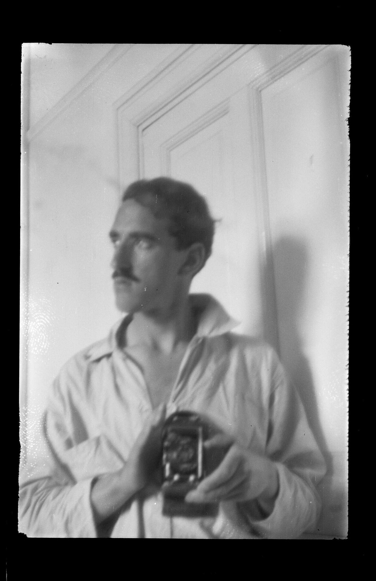 Charles Brasch with camera (self portrait)