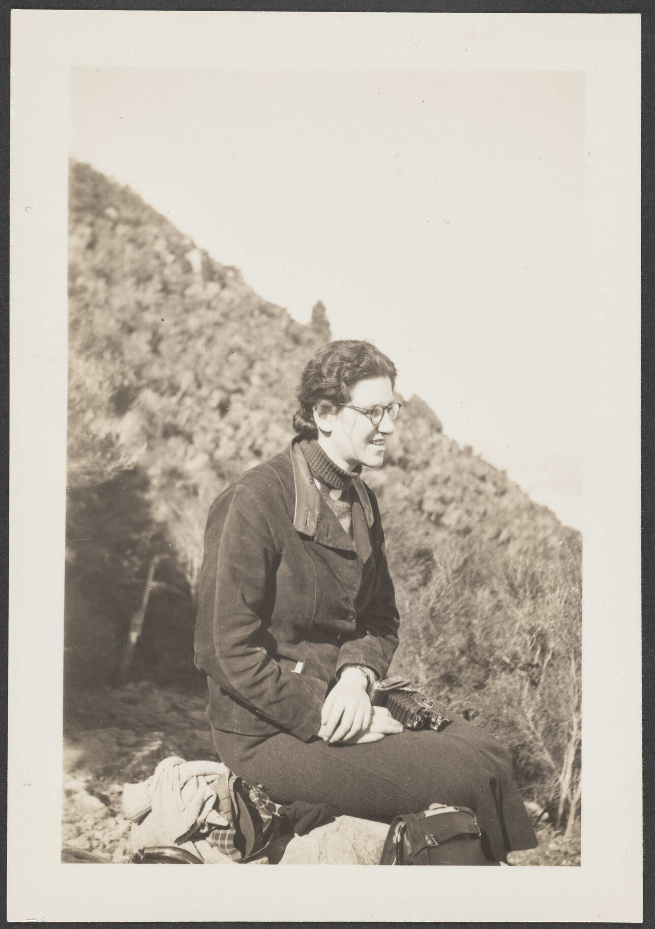 Lesley Brasch outside with a camera in hand