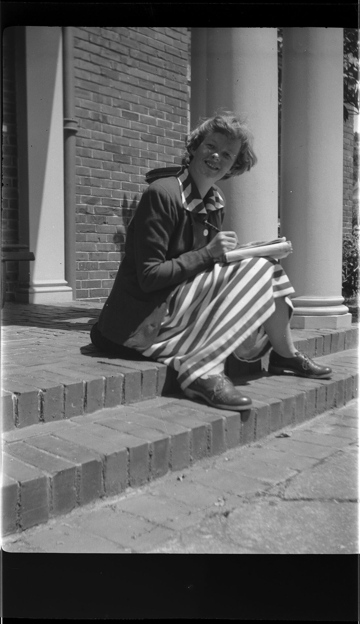 Margaret Scott sitting on a step