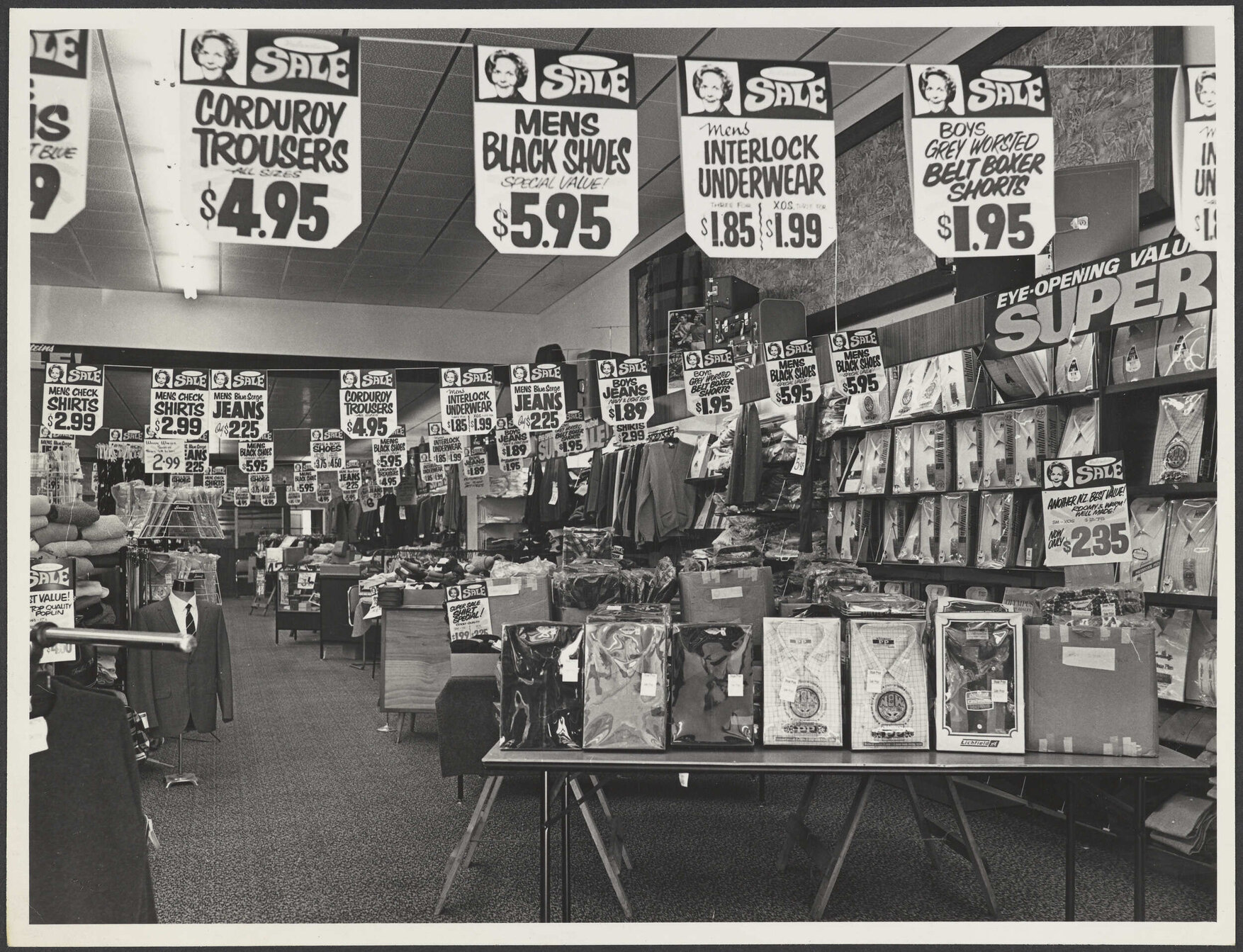 Shop floor with sales advertising at Hallensteins branch premises, Whangārei