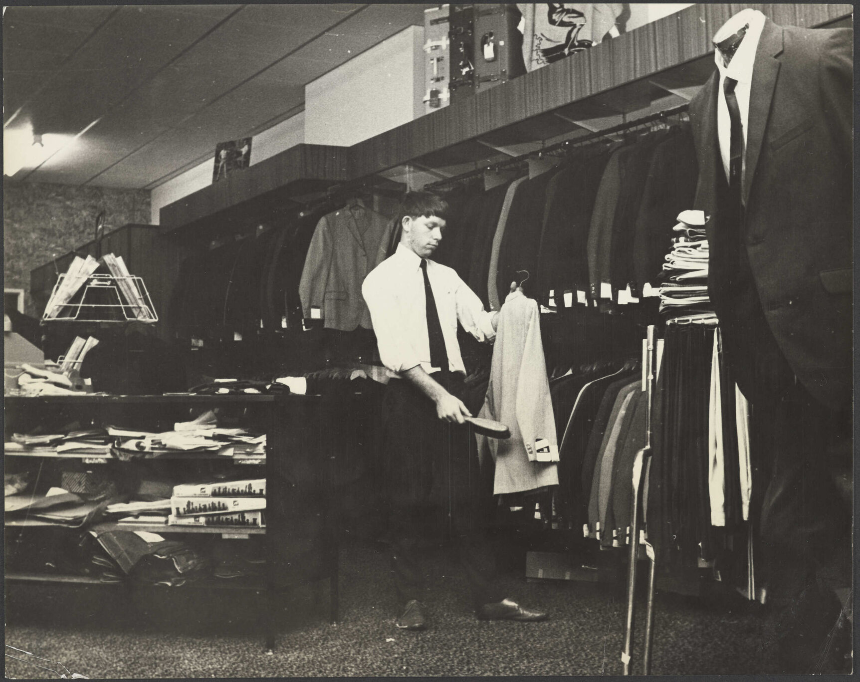 Shop interior and staff member at Hallensteins, Whangārei