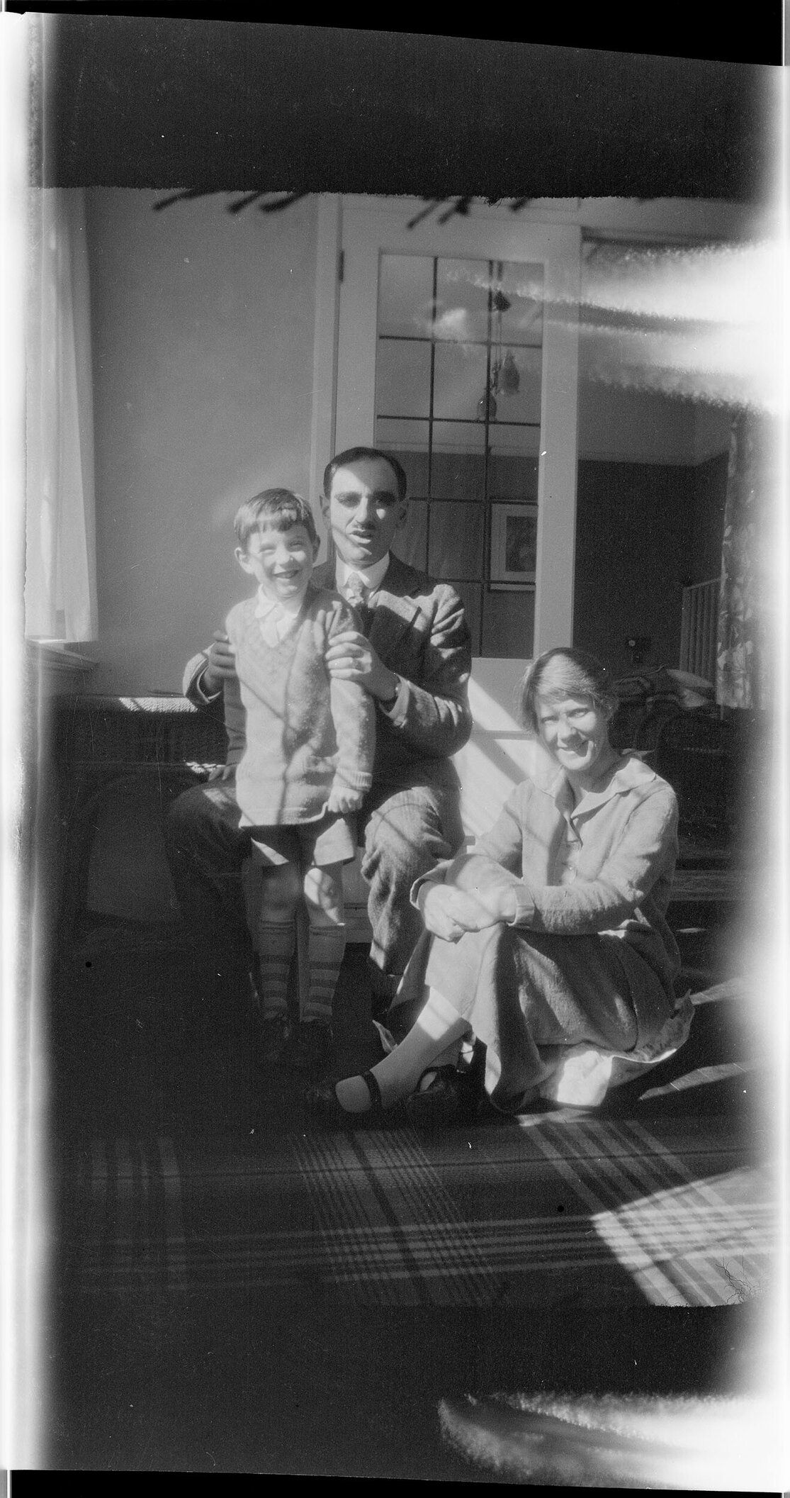 Child, man, and woman, indoors