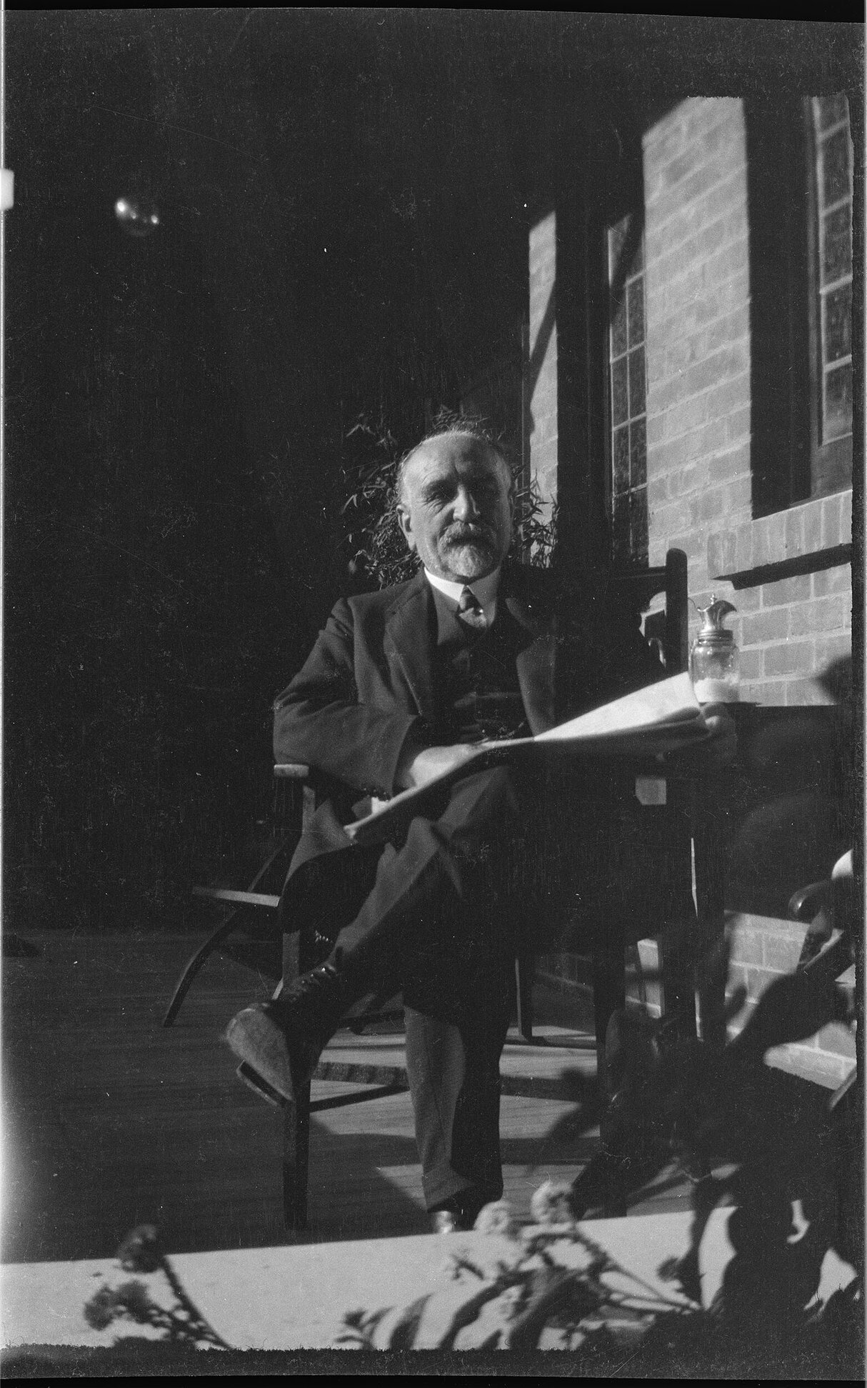 Willi Fels, seated outdoors