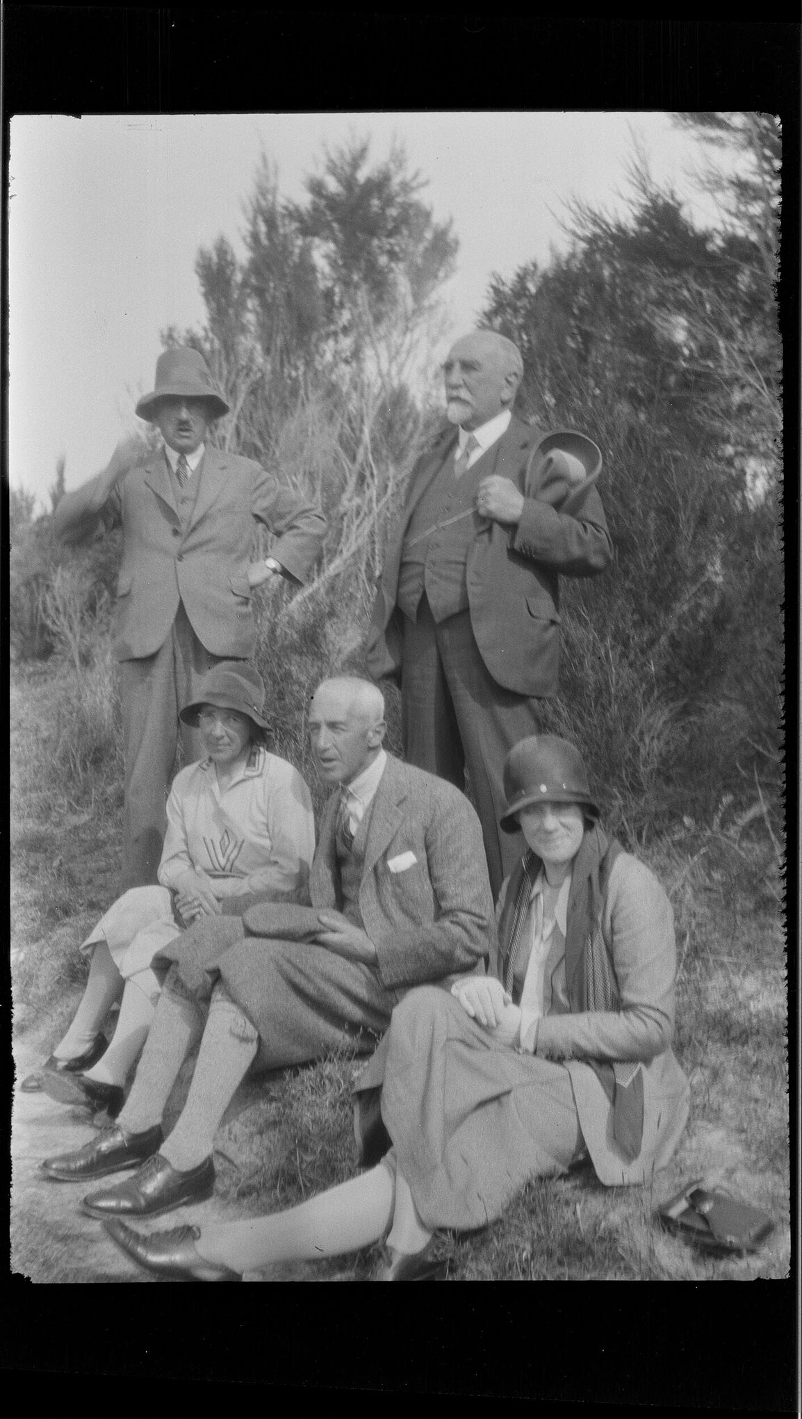 Group of five outdoors, including Willi Fels and Henry Brasch