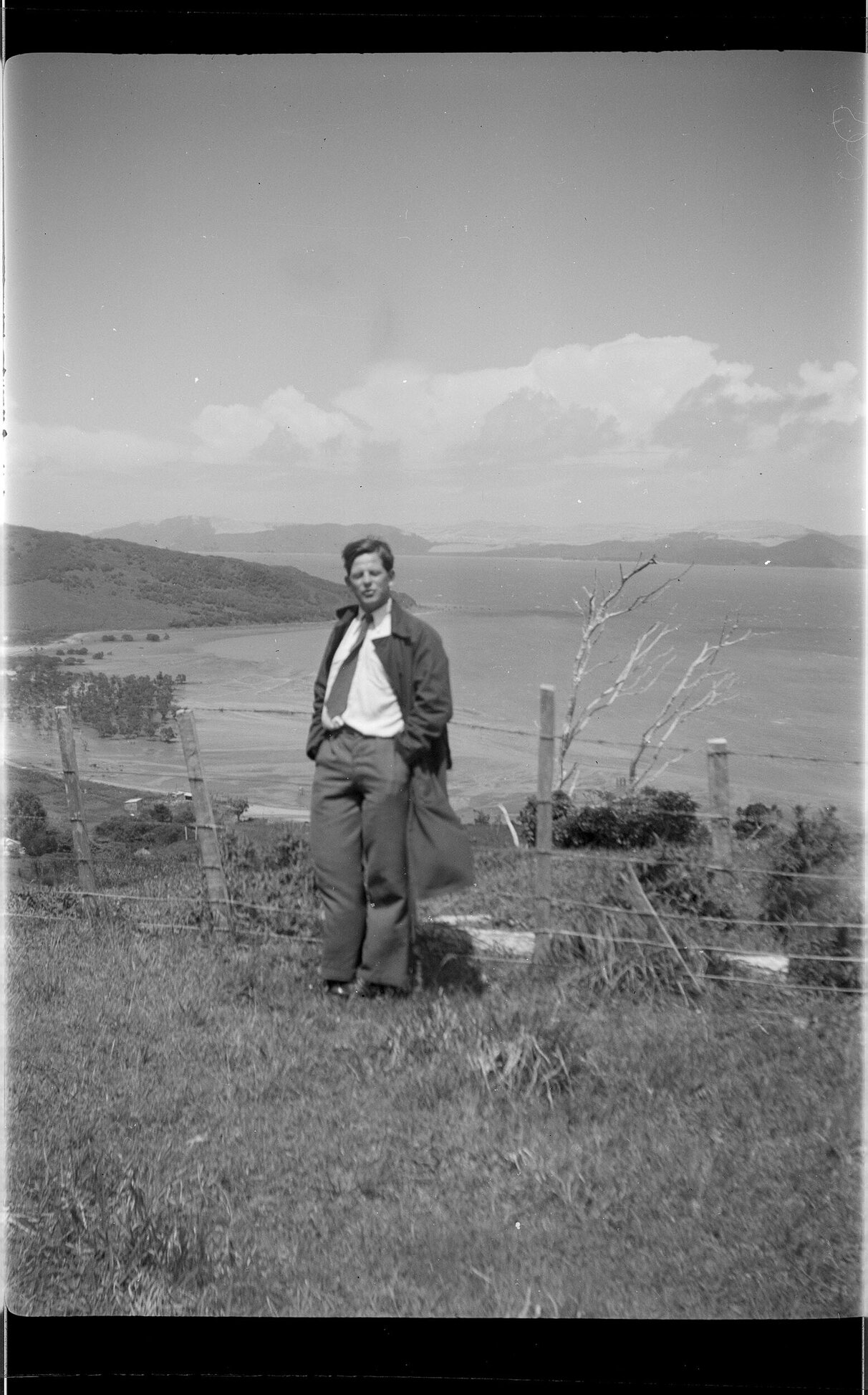 Man with coastal view behind