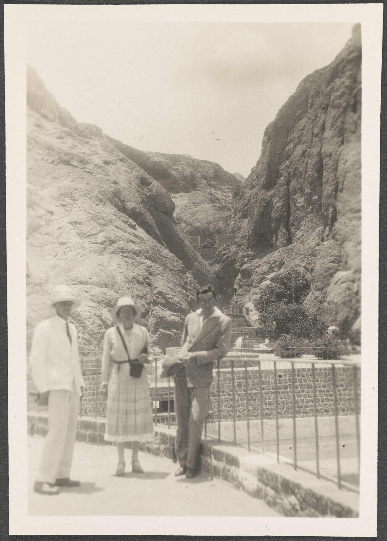 Three people at the Cisterns of Tawila in Aden