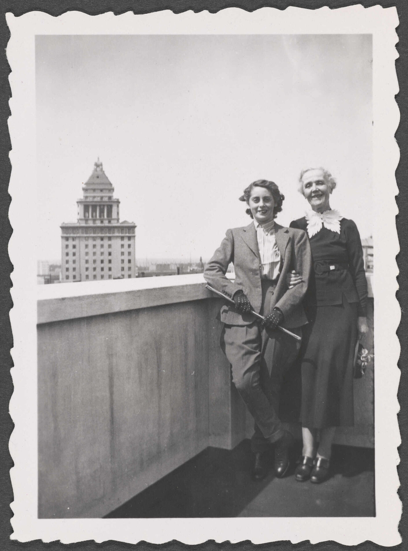 Two unknown women on a rooftop