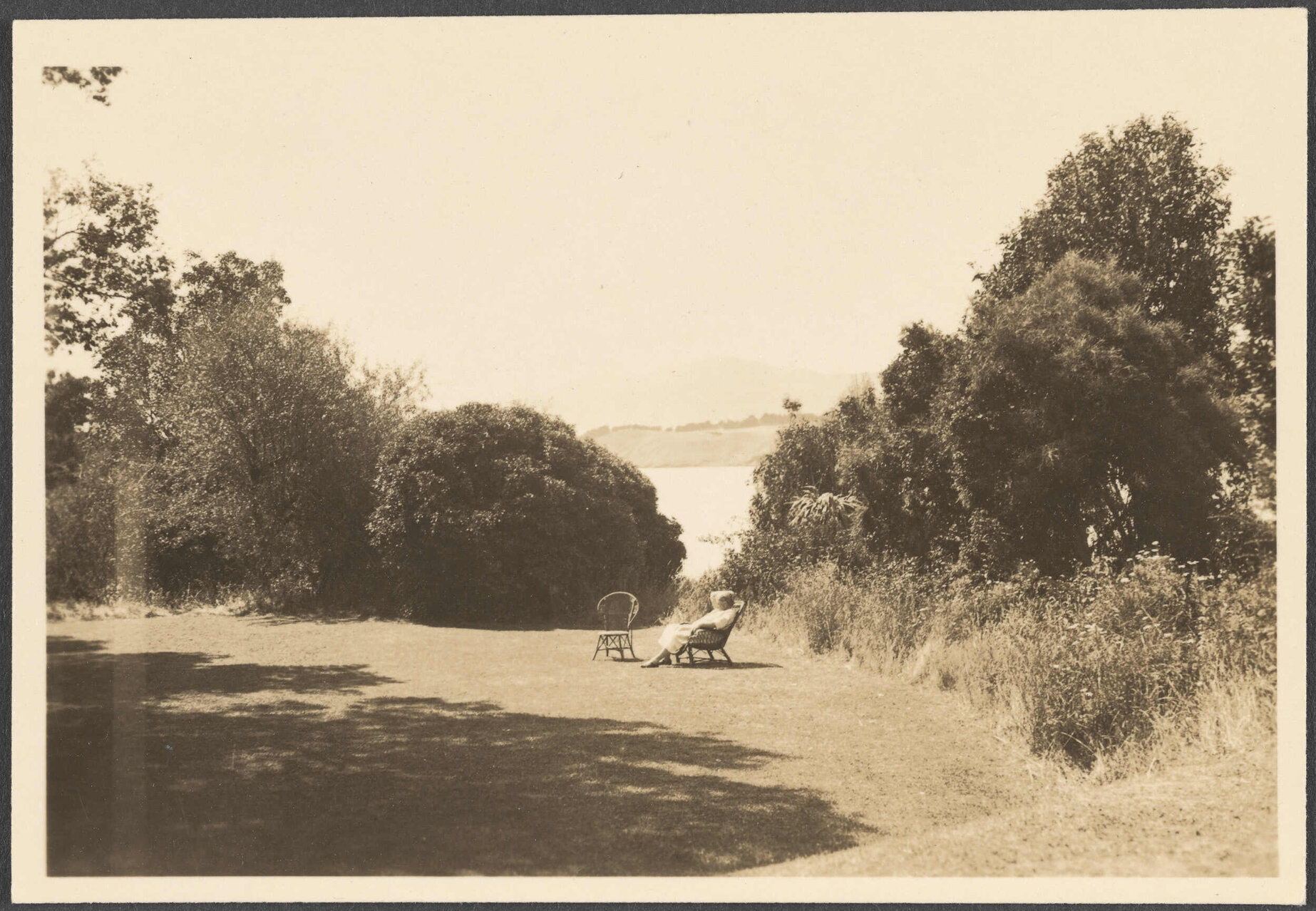 Unknown woman seated overlooking Governor's Bay
