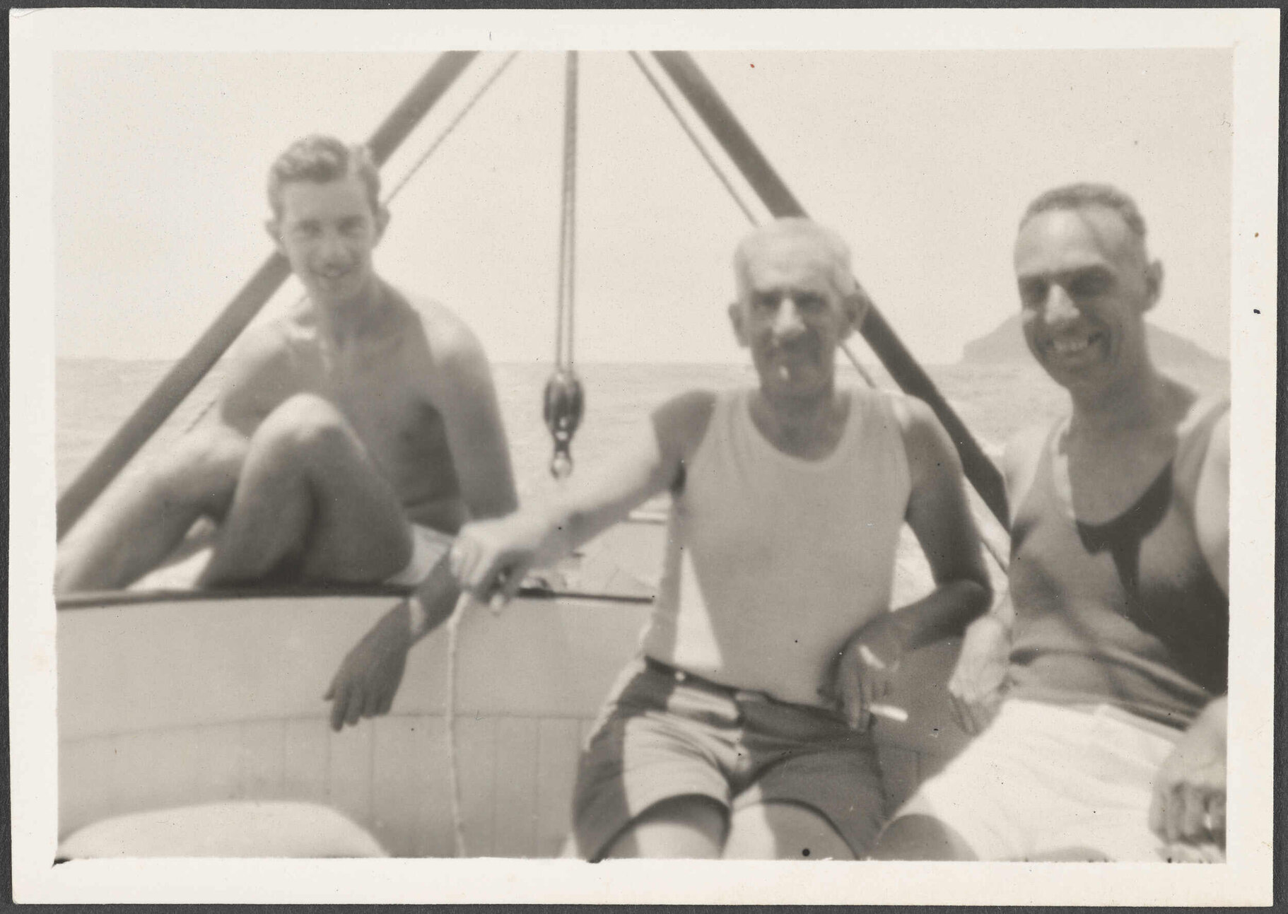 Three unknown men on a boat