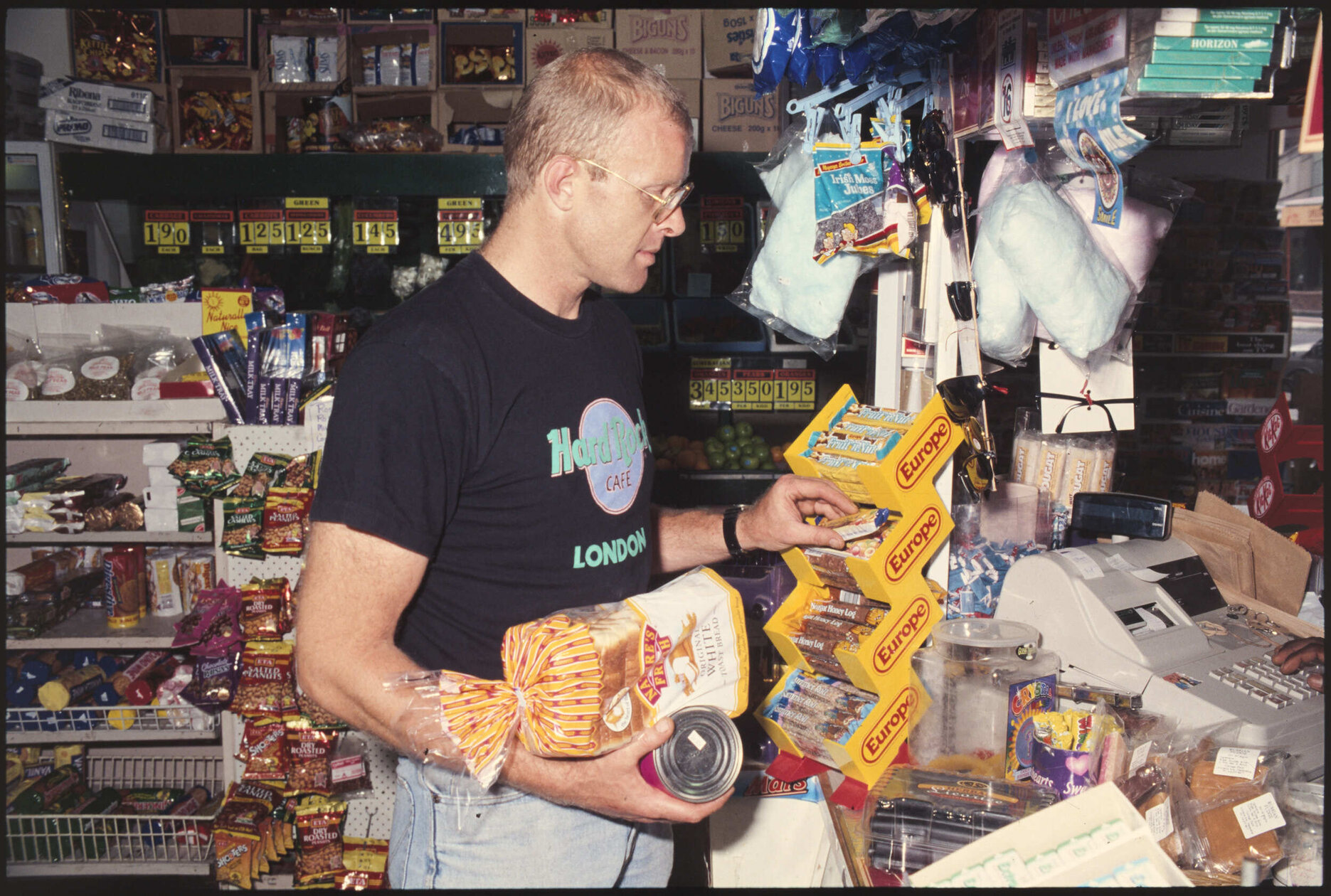 Customer in dairy with Europe bars