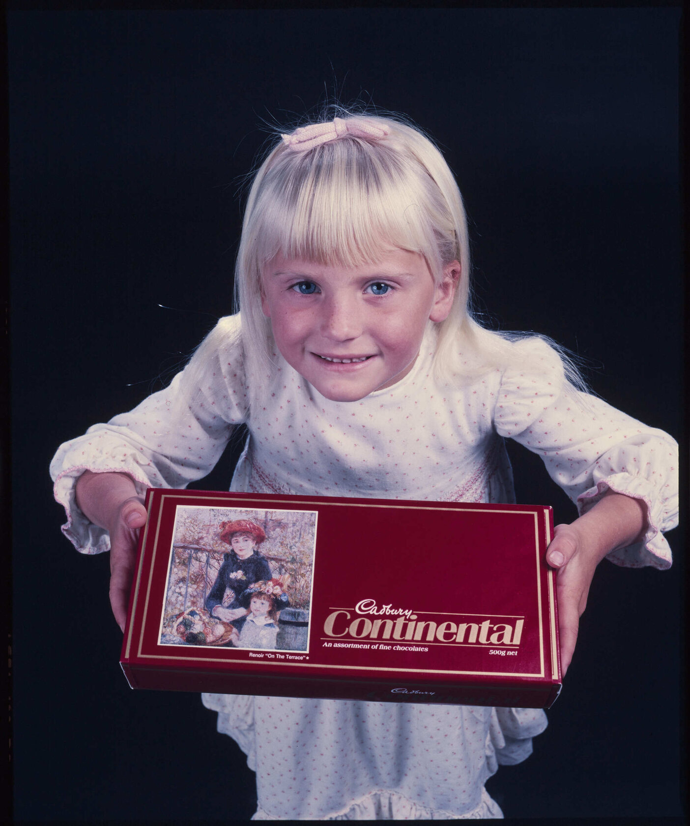Girl with Cadbury Continental box