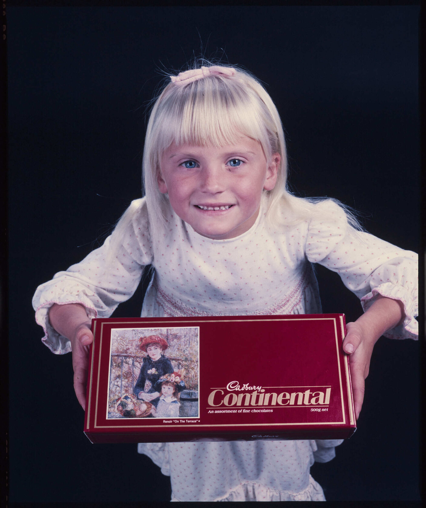 Girl with Cadbury Continental box