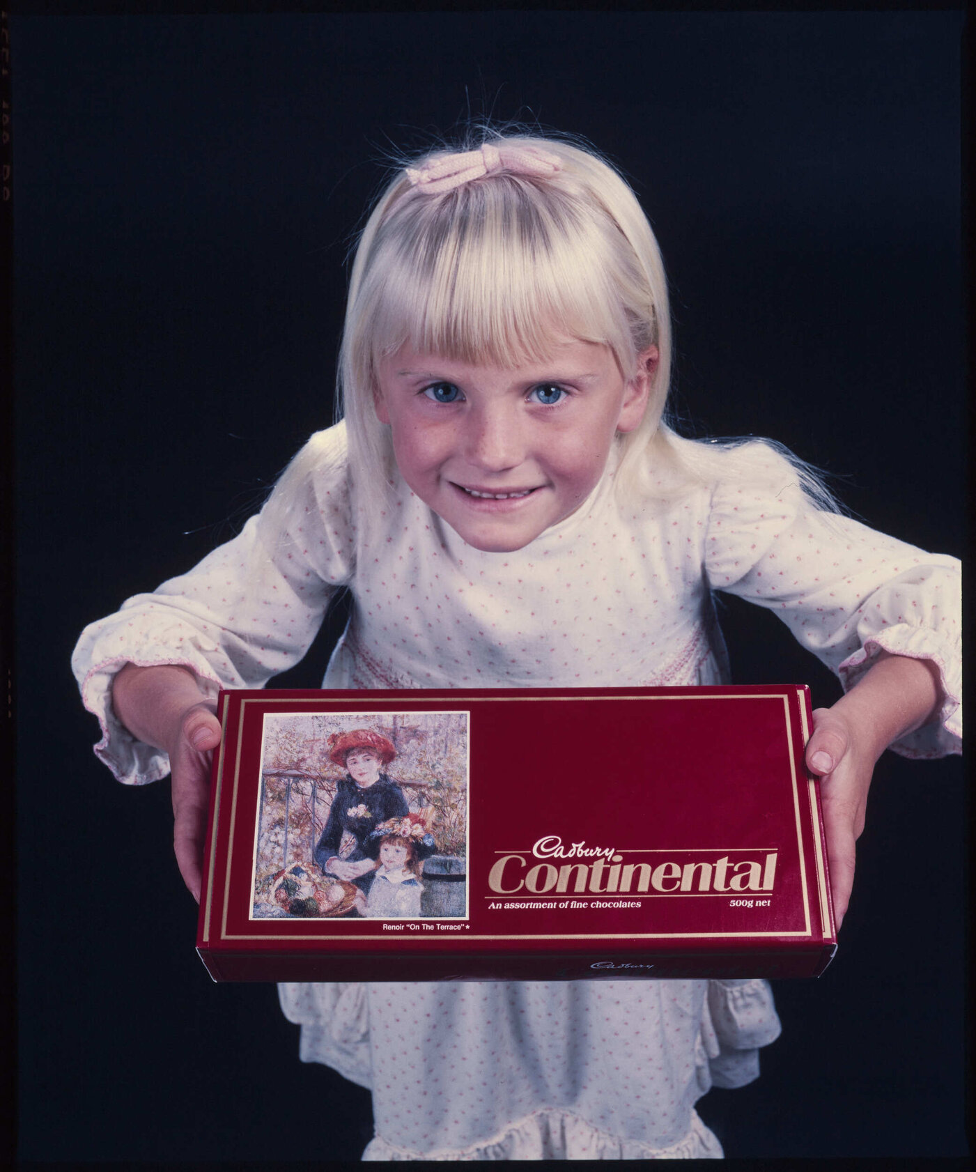 Girl with Cadbury Continental box