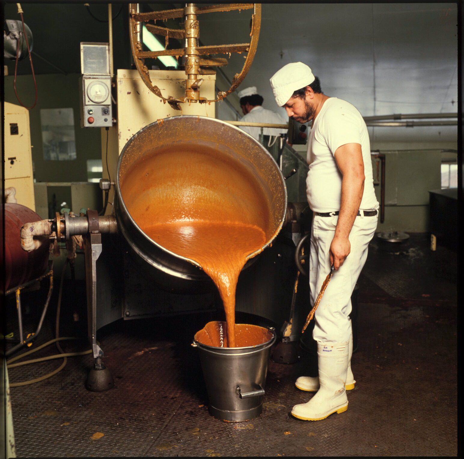 Cadbury machinery operator with liquid caramel