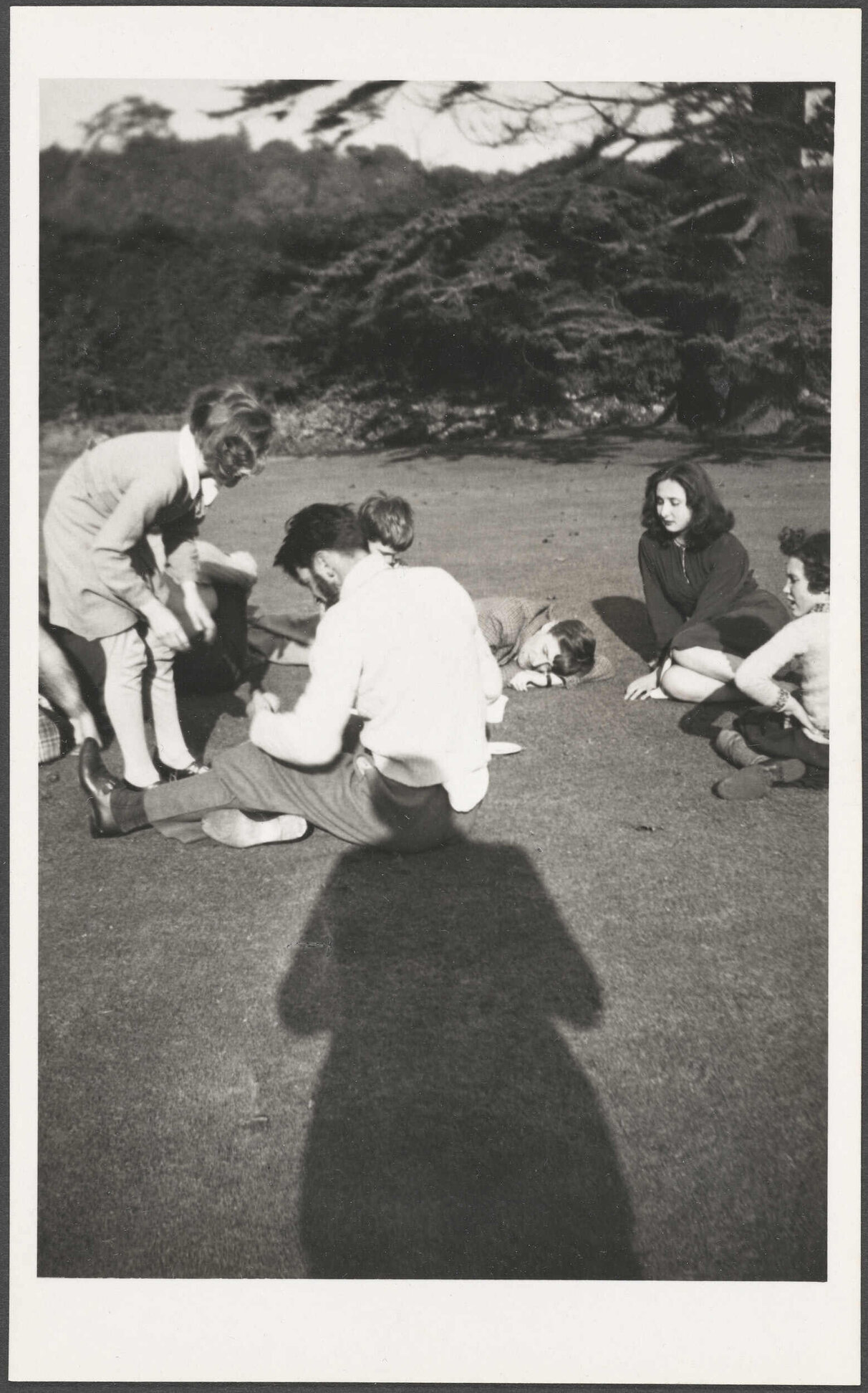 Pupils at Abbey School sitting on the grass