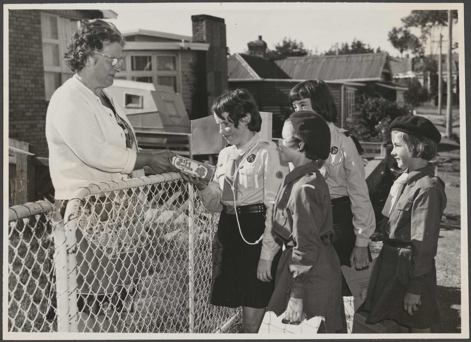 Guides and Brownies selling Girl Guide biscuits