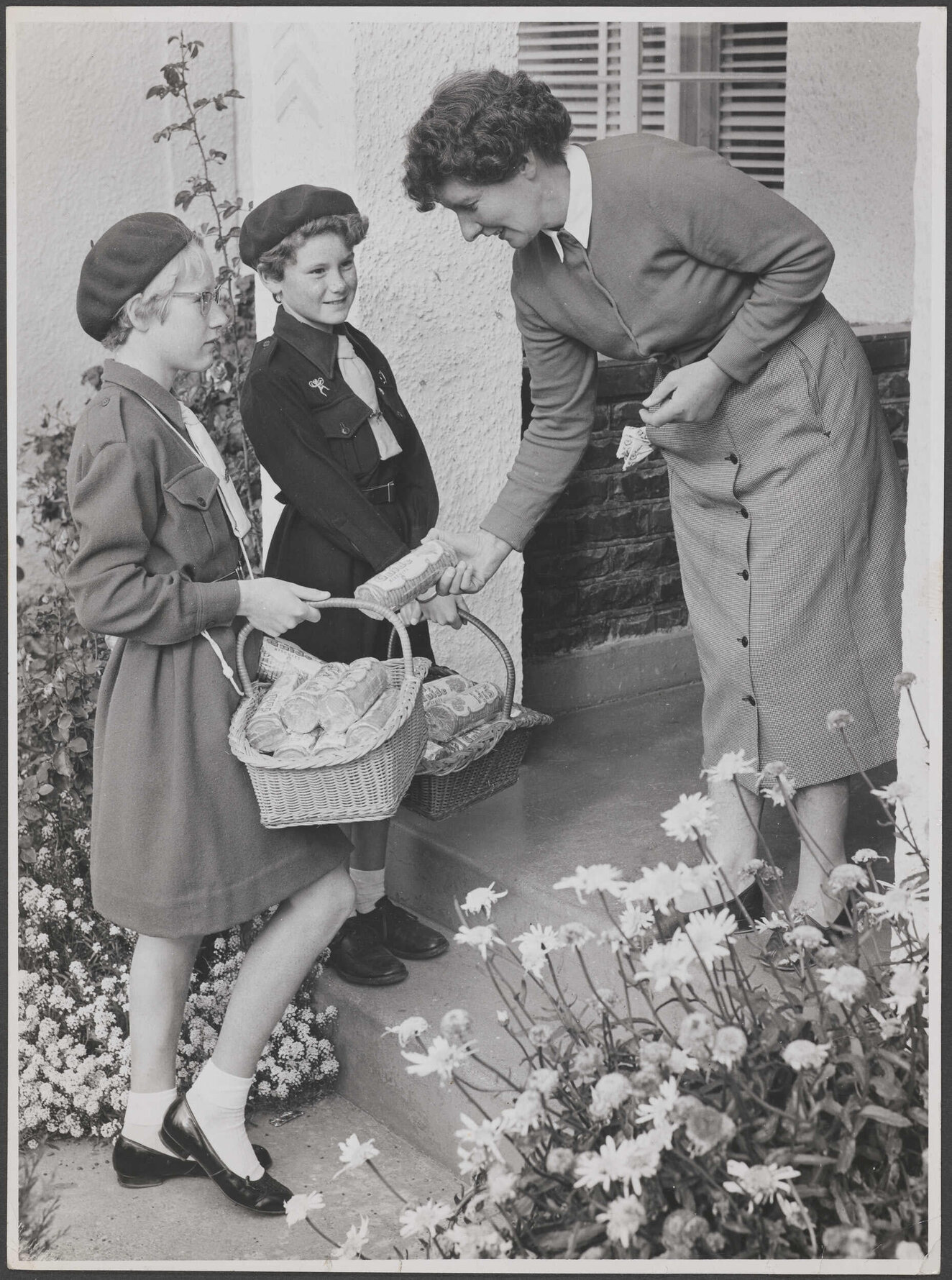 Girl Guide and Brownie selling biscuits at Invercargill
