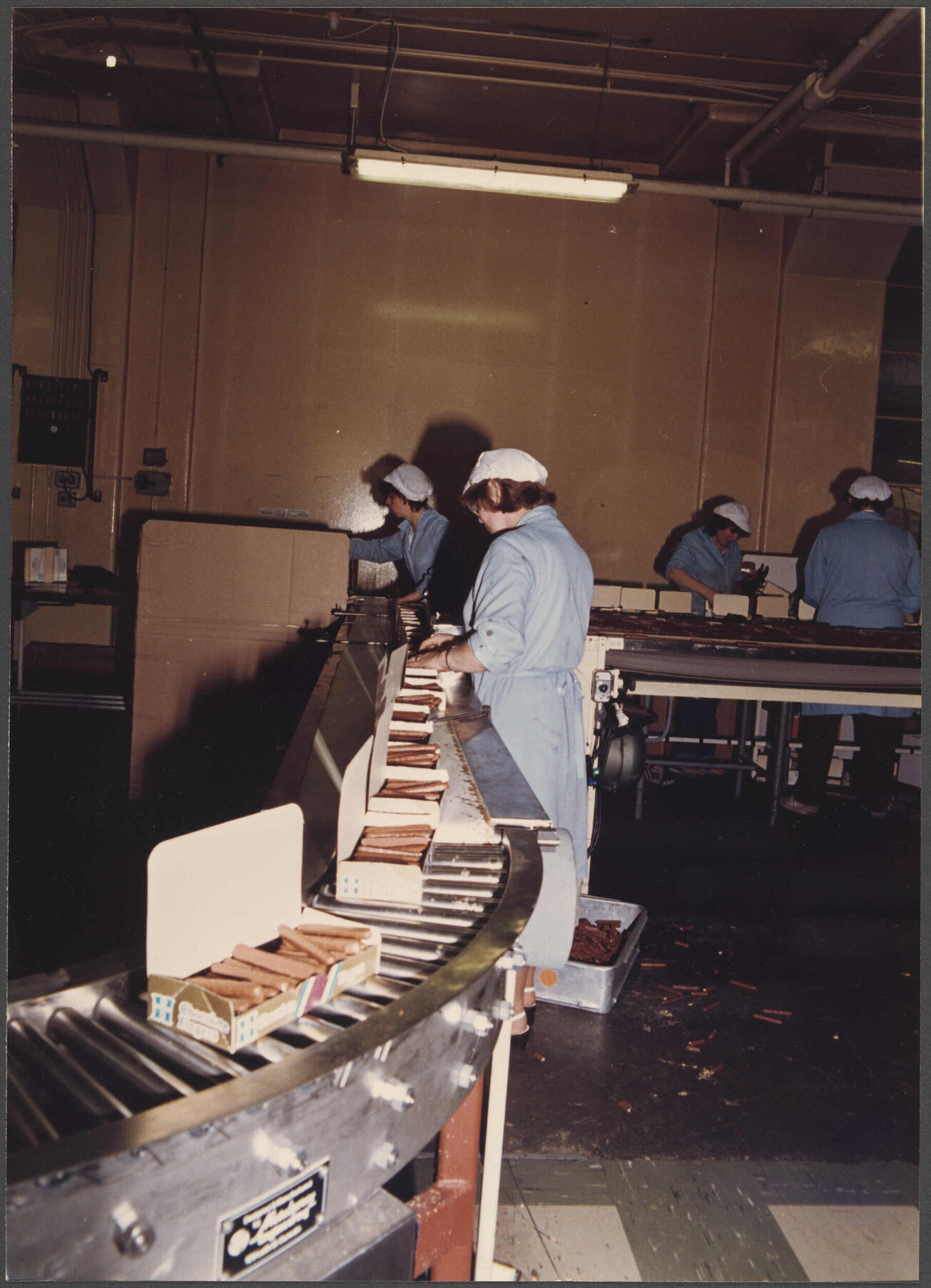 Finger Biscuits. Loaded cartons approaching checkweigher.