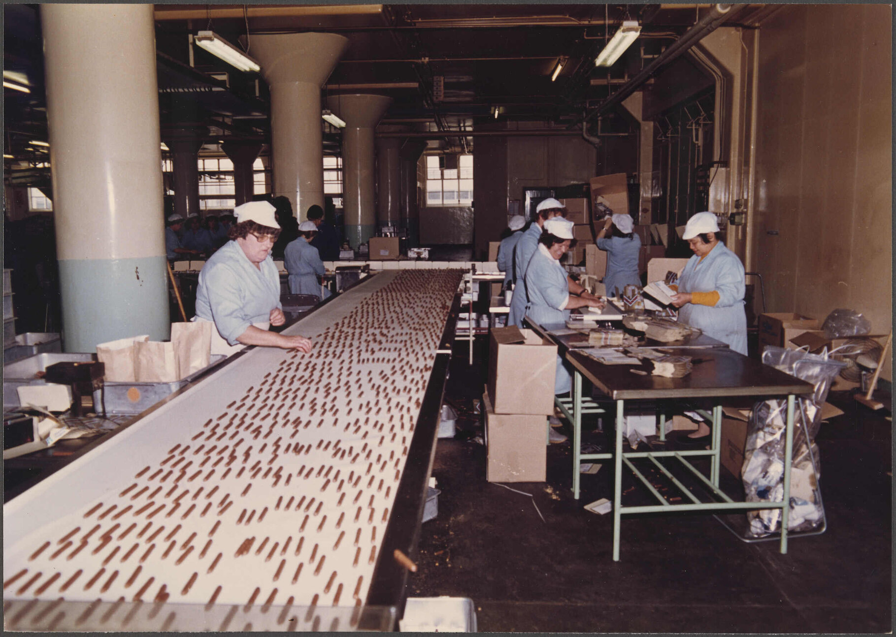 Finger Biscuits. Making up empty cartons in background.