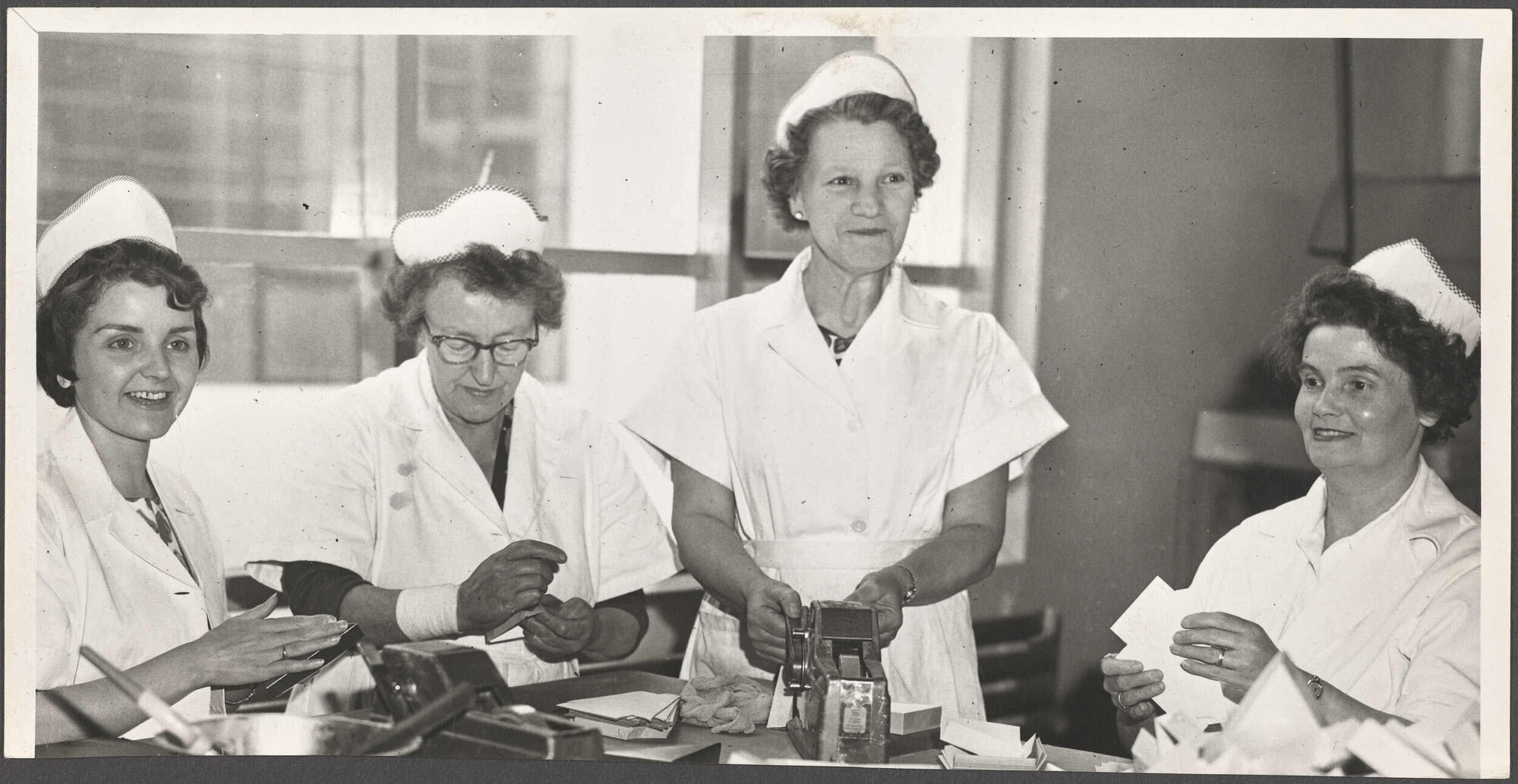 Mavis Welsford (Boxroom Forewoman) with three other women
