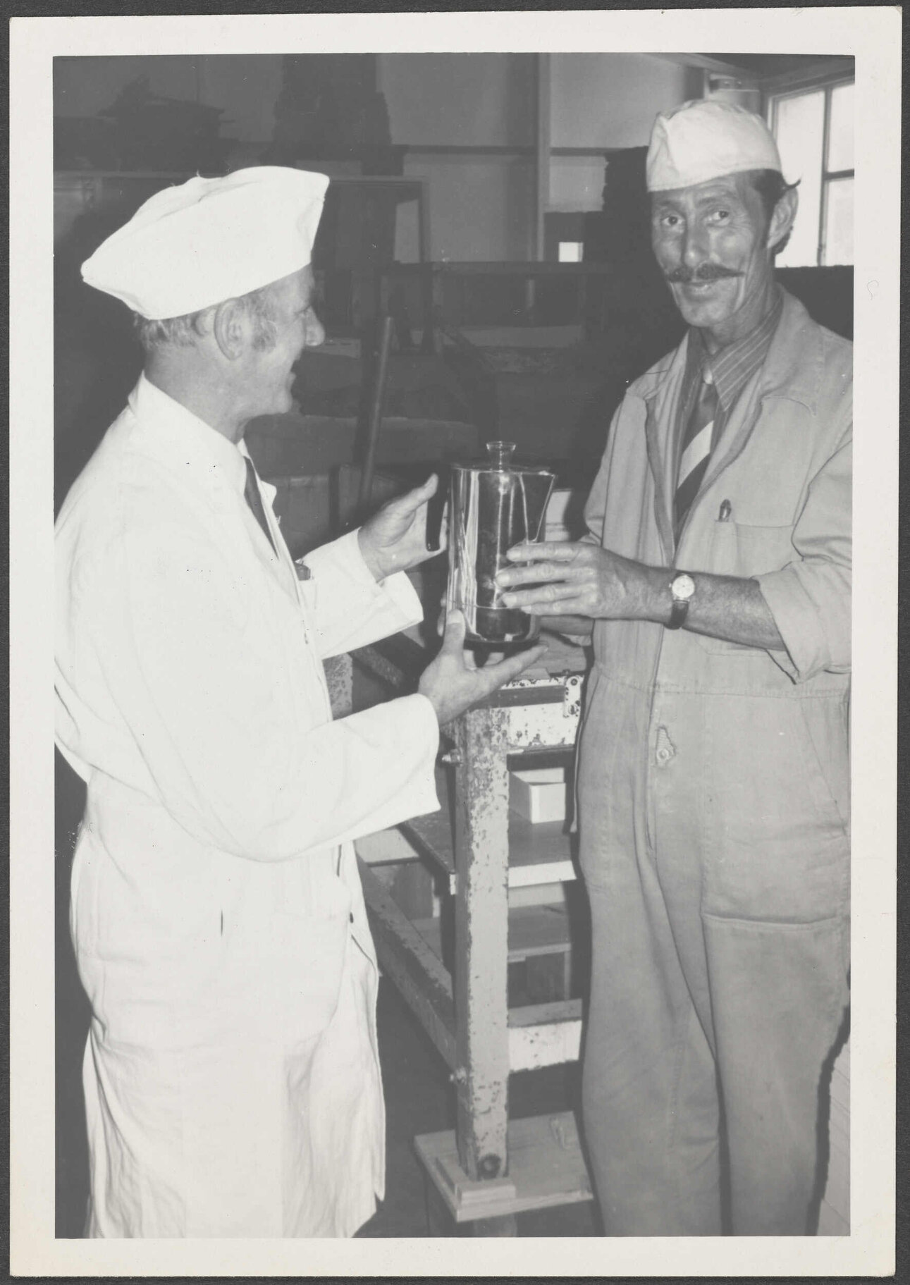 Arch McQuarrie presenting Wilf Stanton a gift from his fellow workers