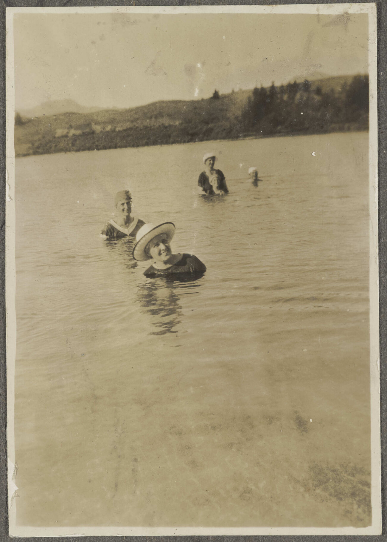 Group of people swimming in a lake