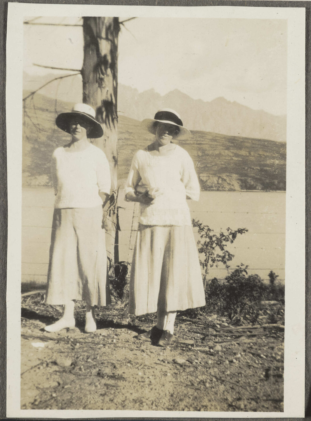 Two unidentified women wearing hats