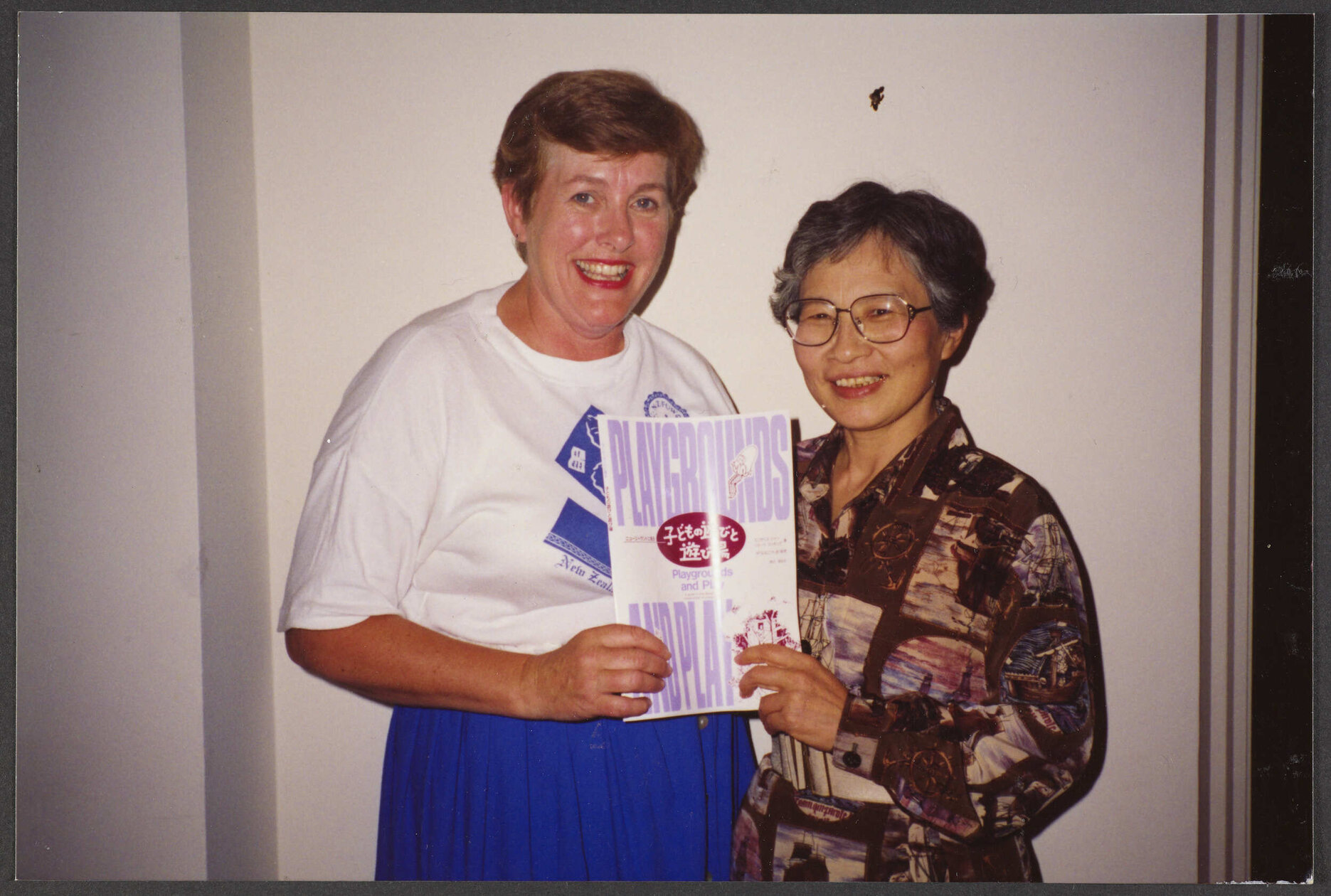 Elizabeth Hanan and unidentified woman with Japanese translation of Hanan's book 'Playgrounds and Play'