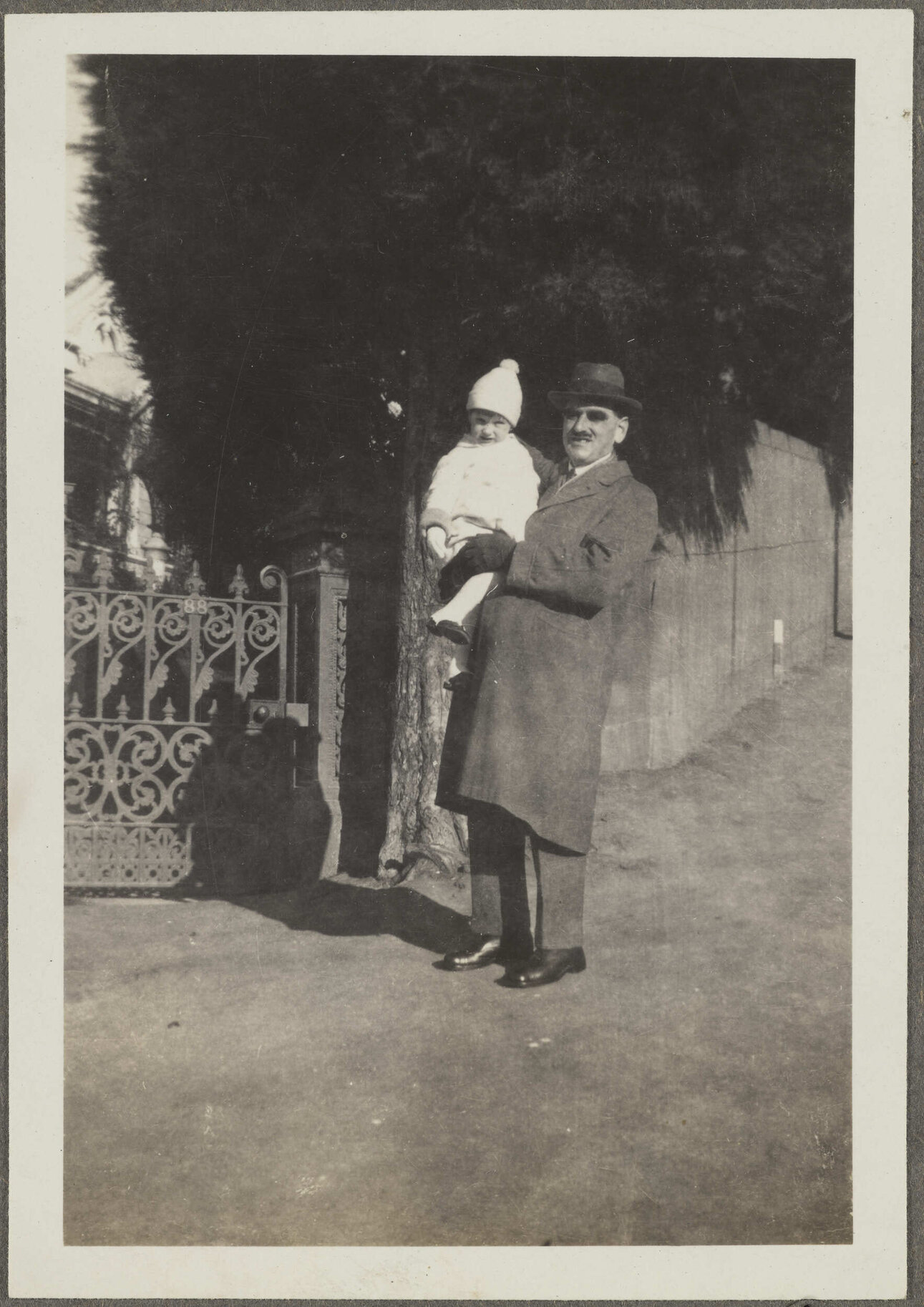 Unidentified man holding child