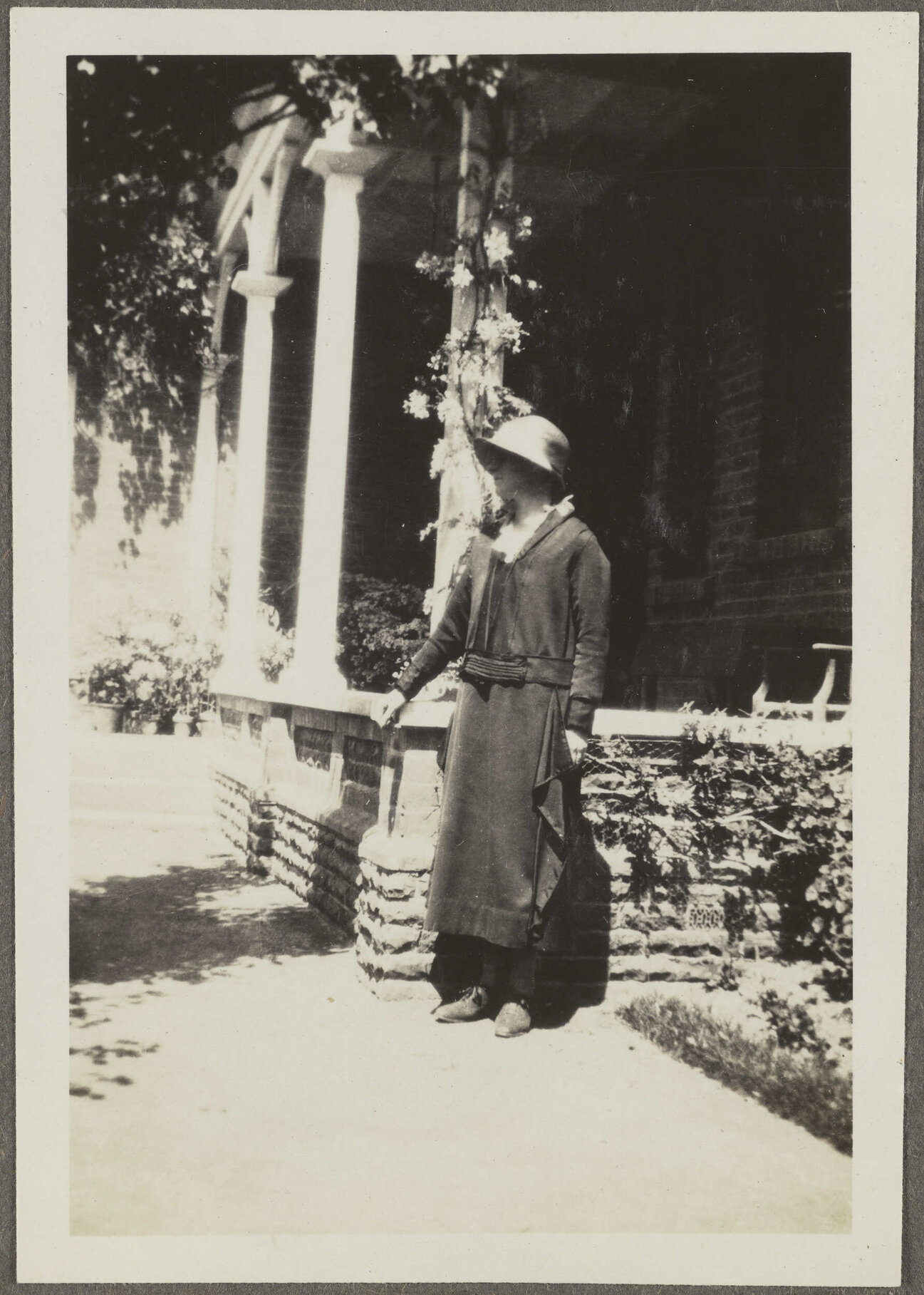 Unidentified woman by porch