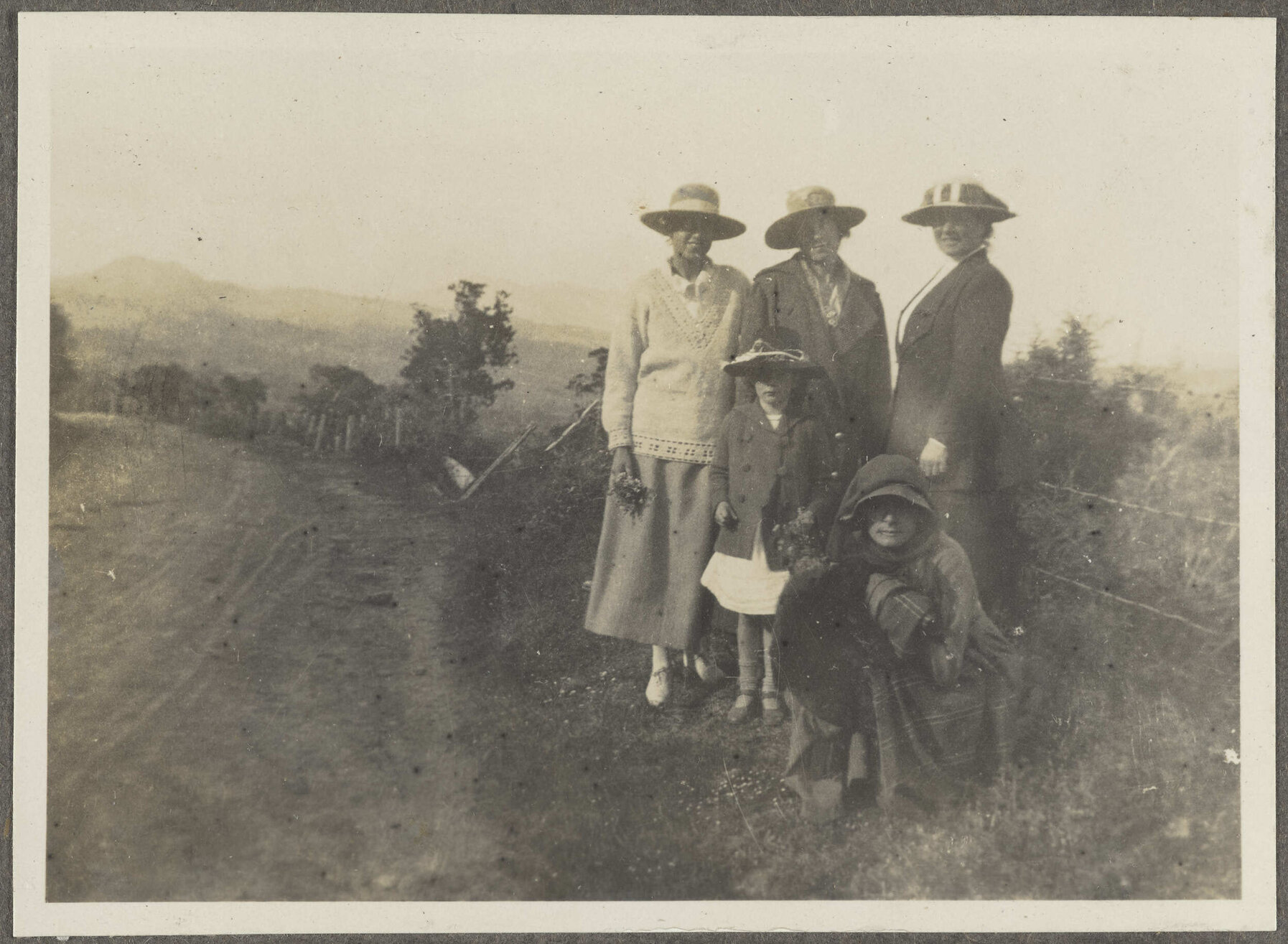 Four unidentified women and one child