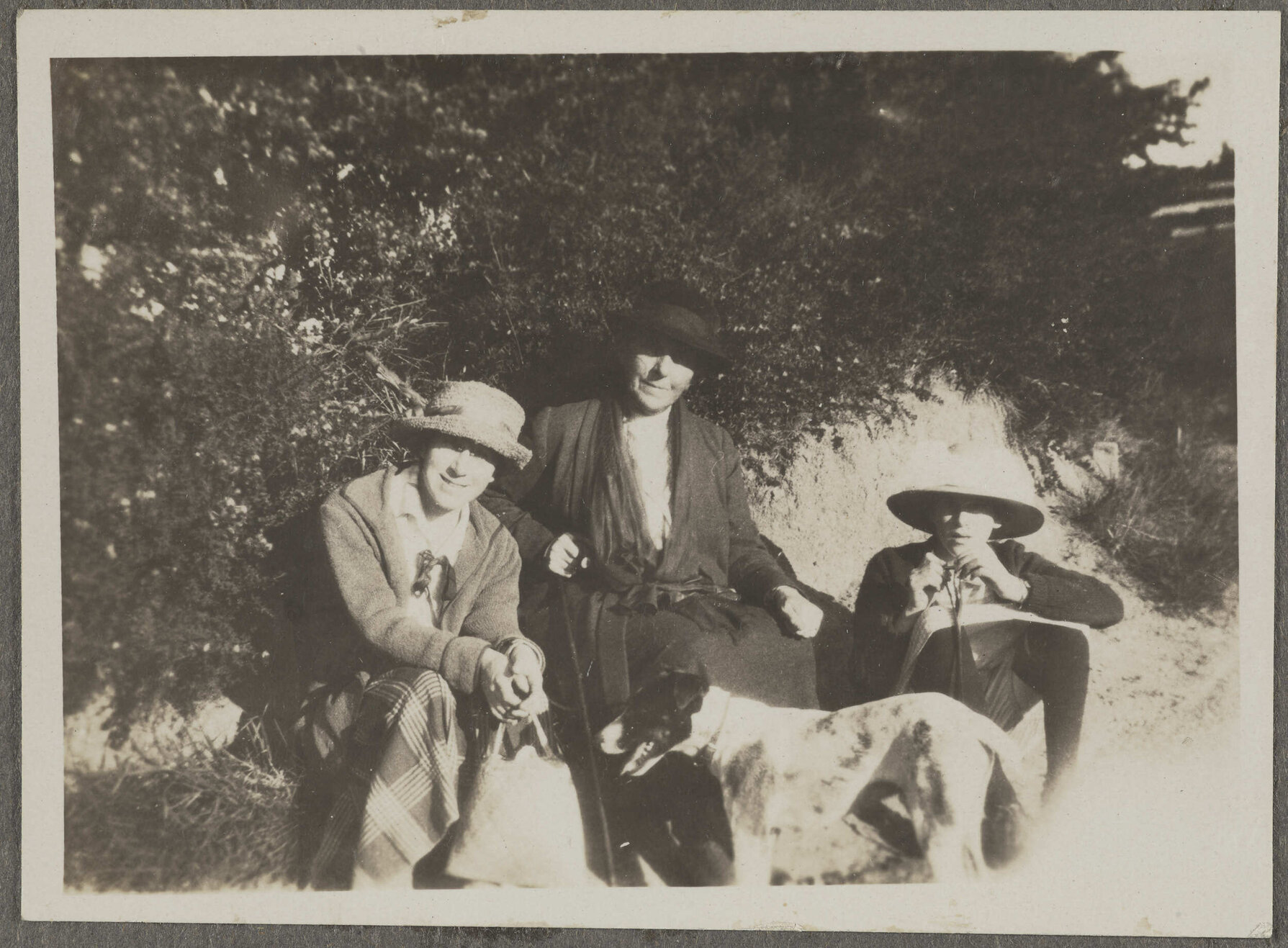 Two unidentified people and [Lesley Brasch] with dog