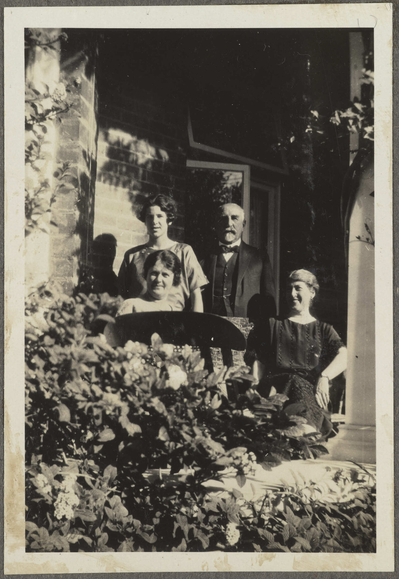 Willi Fels and three unidentified women on porch