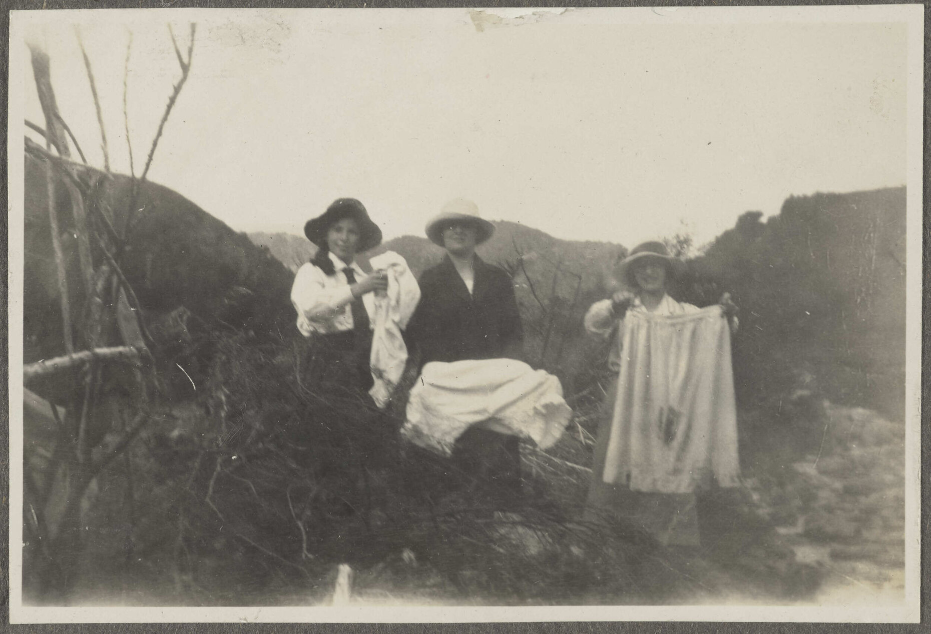 Lesley Brasch and two women airing out clothes