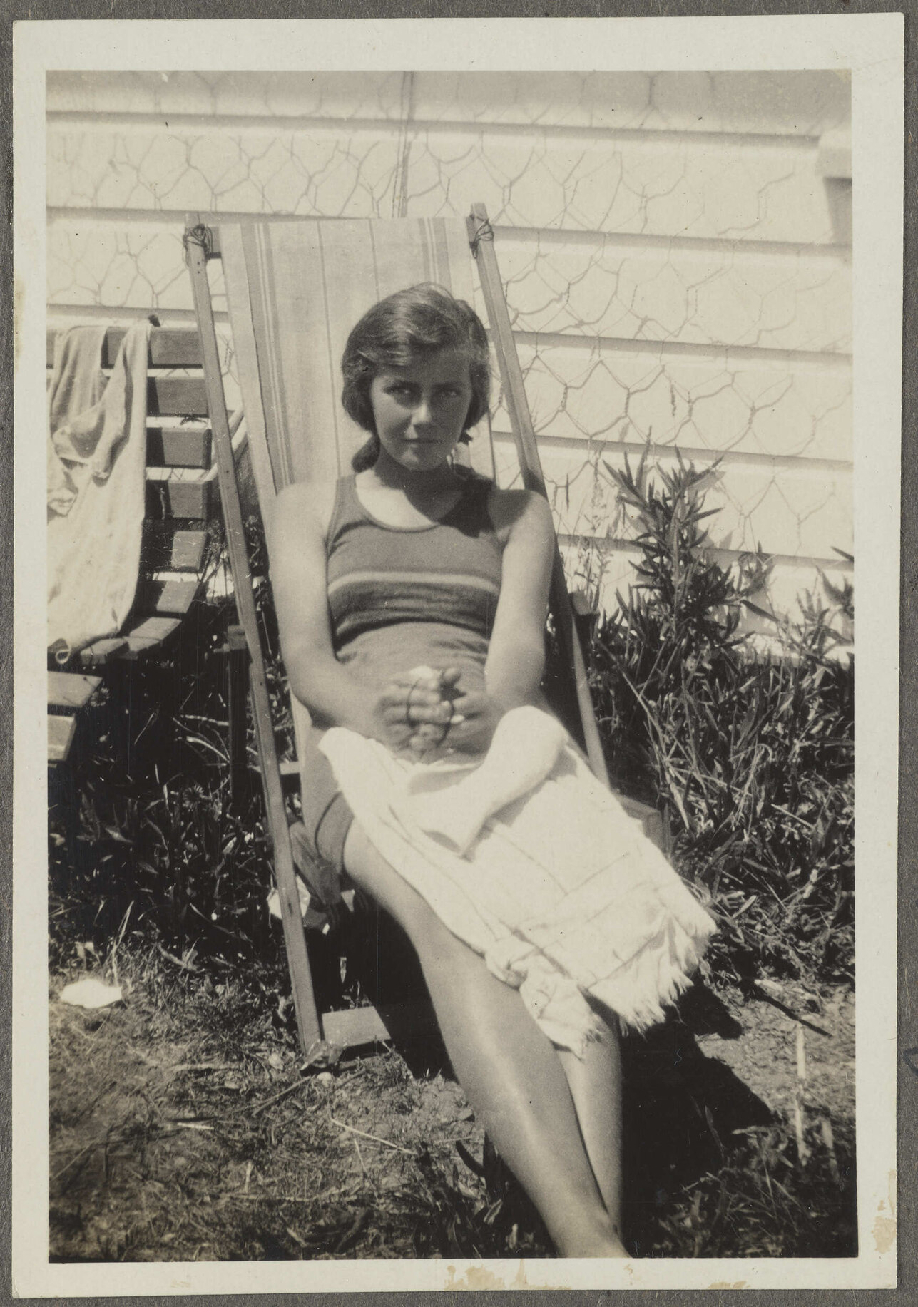 Unidentified woman sitting in chair