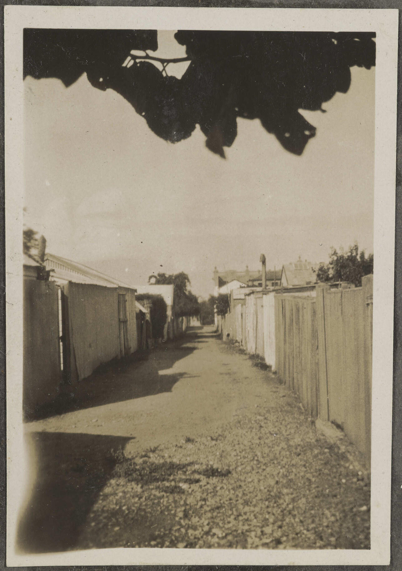 Alleyway with fences and buildings