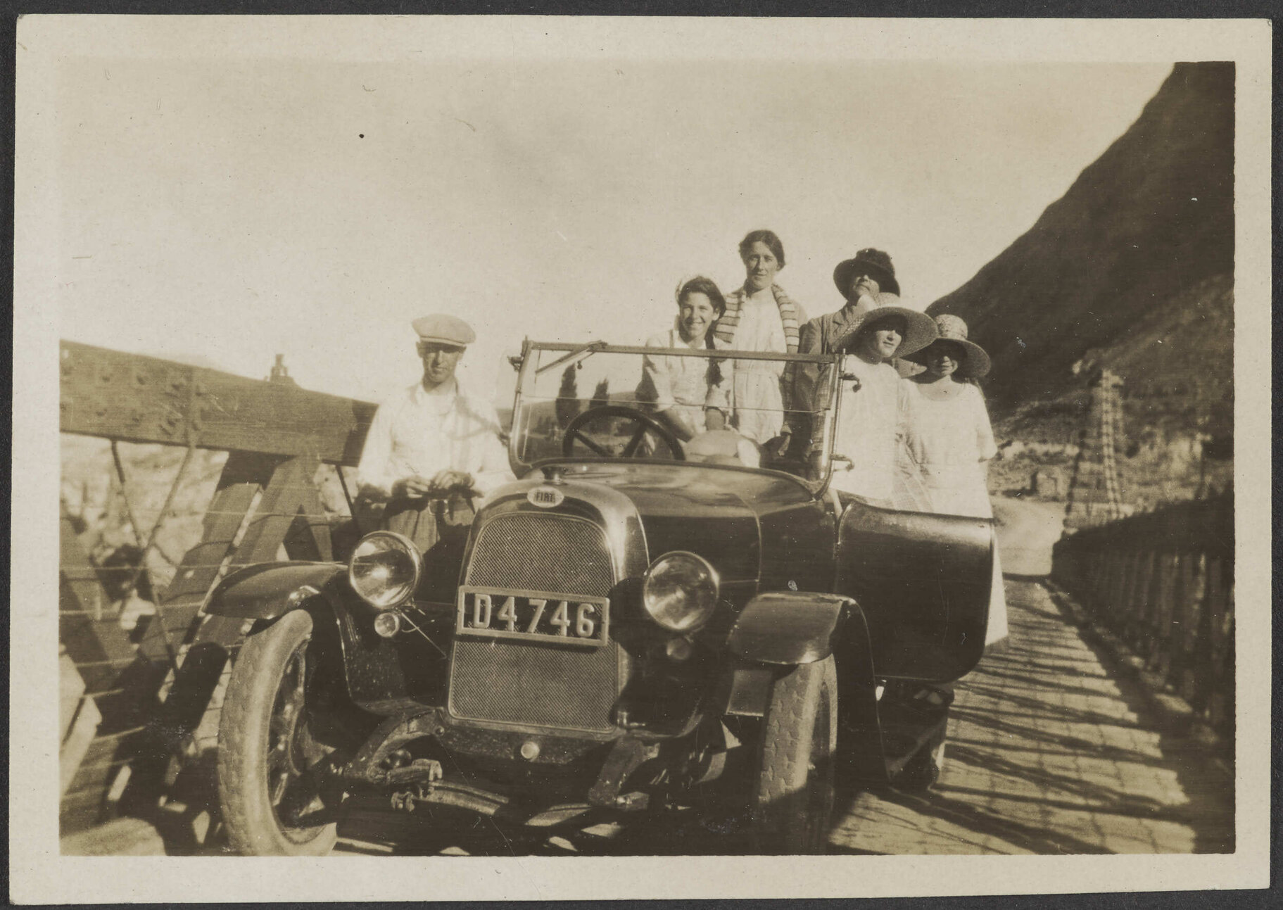 Henry and Lesley Brasch and four unidentified women sitting in a car on bridge