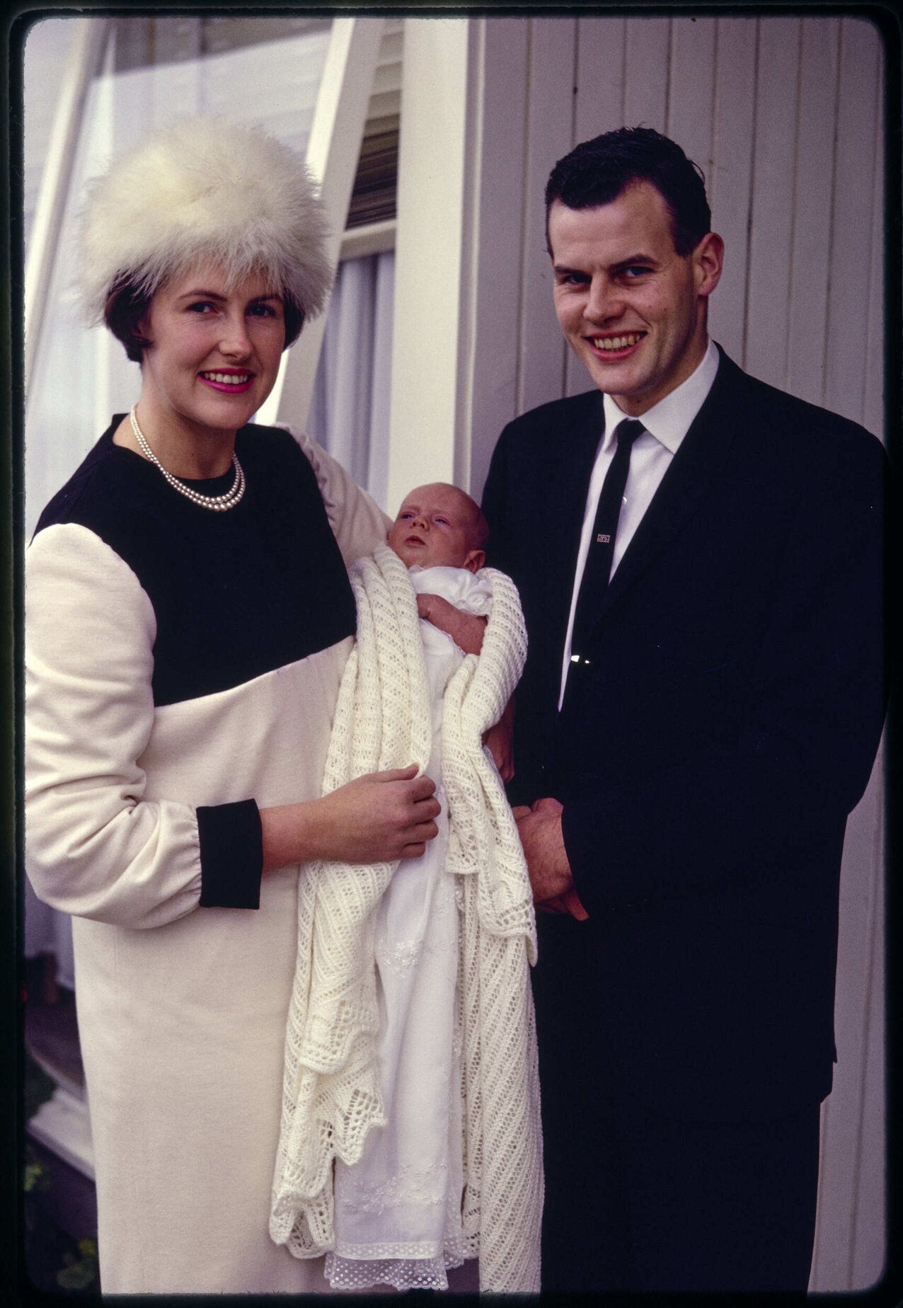 Elizabeth and John Kingsley Walsh with their son Andrew on his christening day
