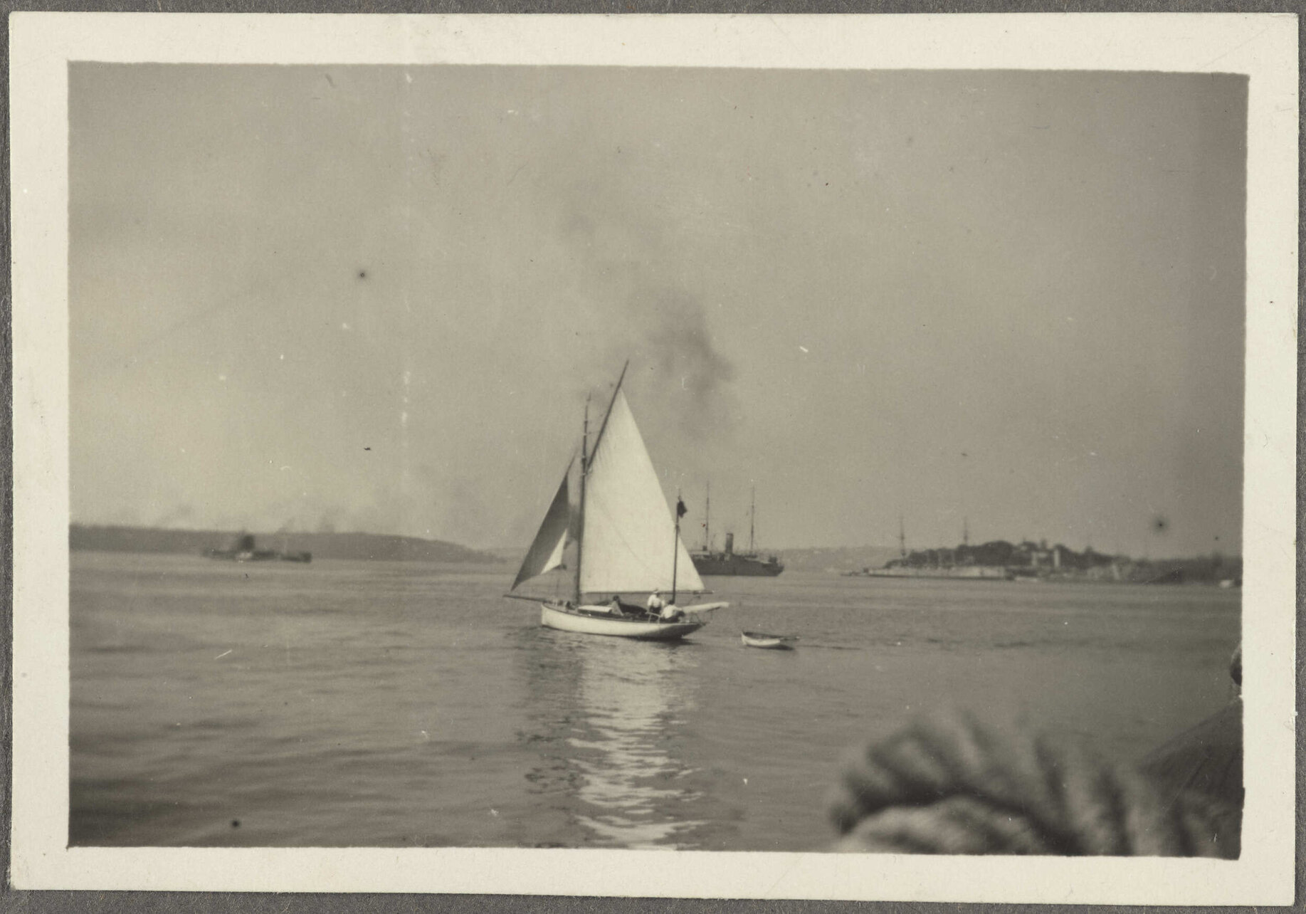 Sailing ship, with steamships in background