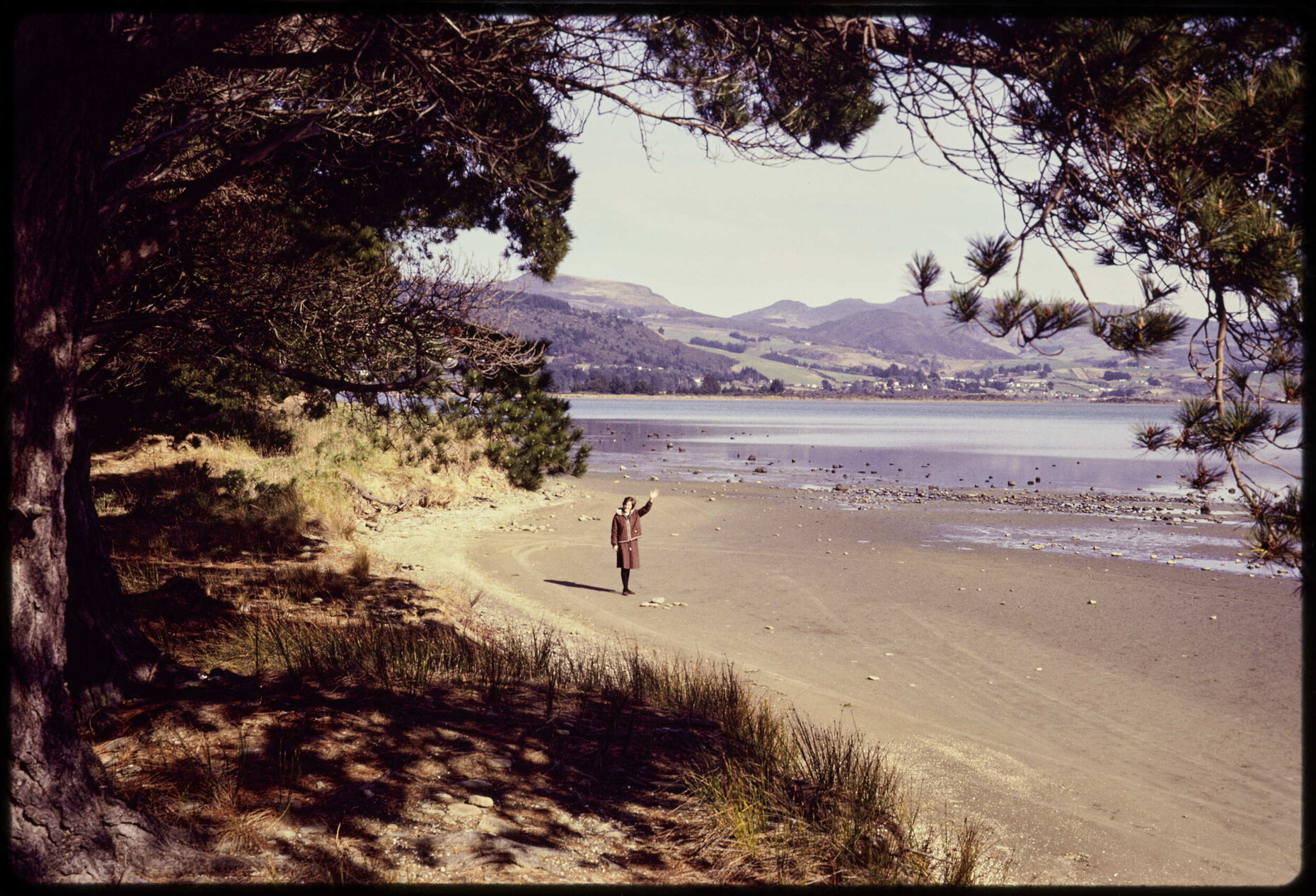 Warrington, with Elizabeth Hanan standing on beach