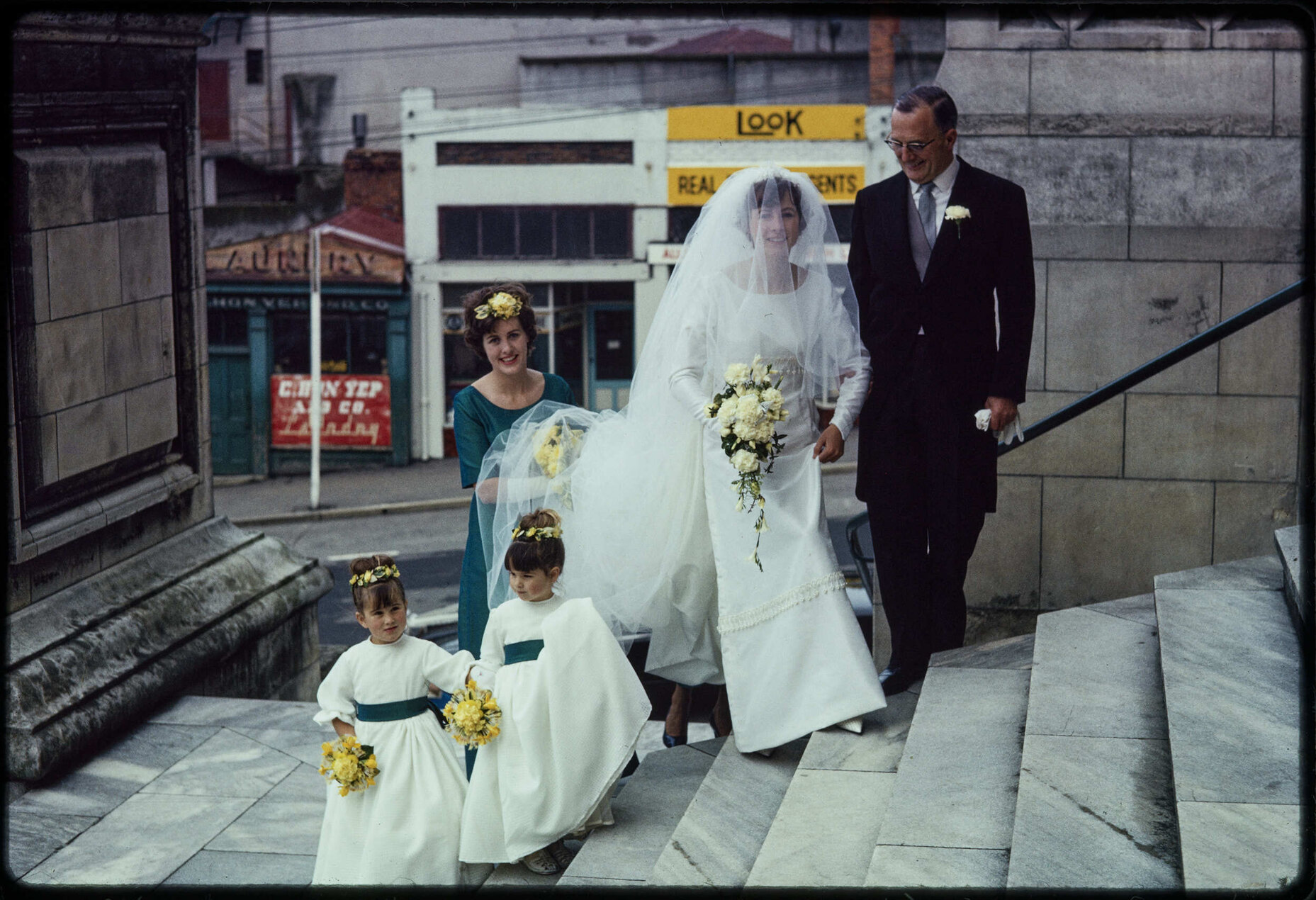 Jennifer Walsh on the day of her wedding, with her sister Elizabeth, father John, and flower girls