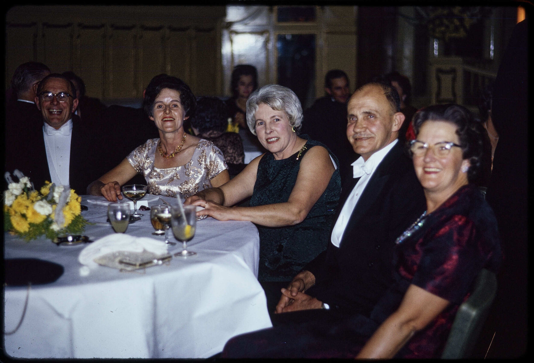 Group at wedding reception, including Sir John and Lady Enid Walsh