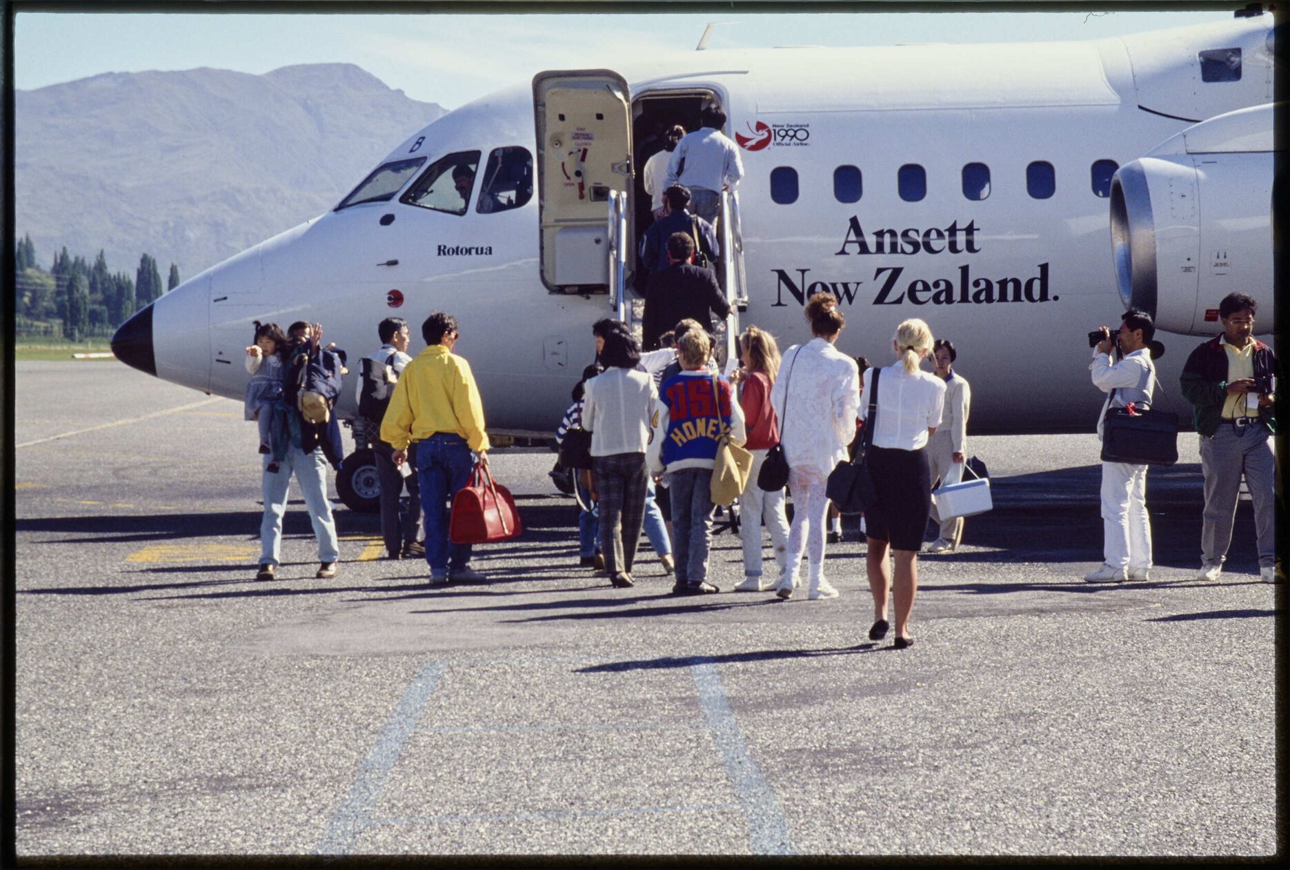 Passengers boarding Ansett New Zealand aircraft [at Queenstown]