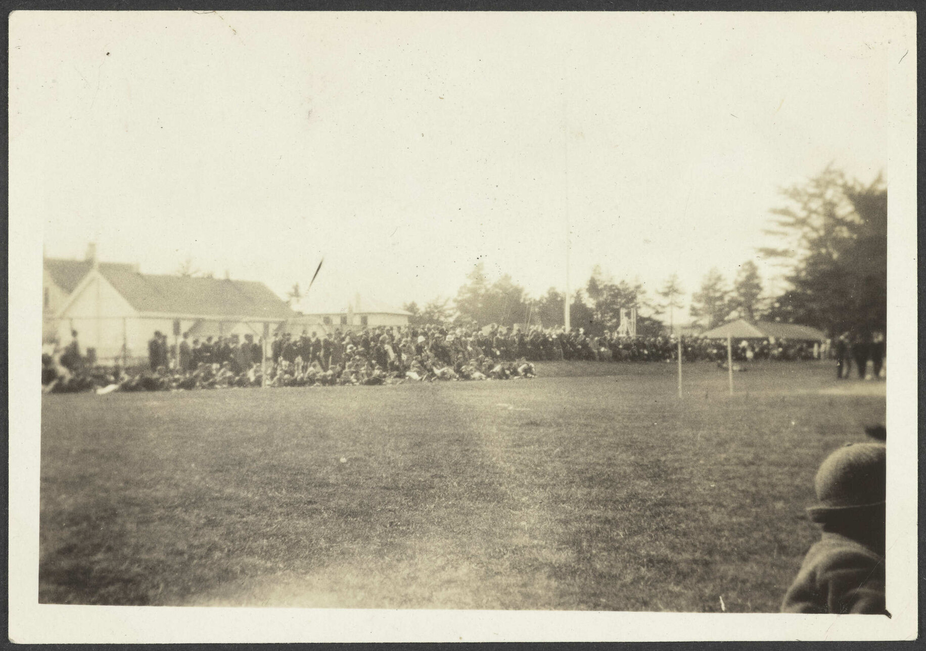 Large congregation on grass field