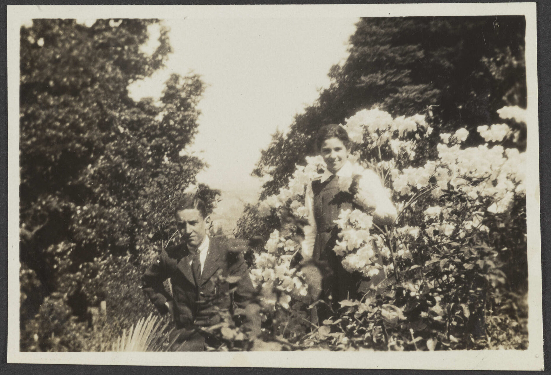 Charles and Lesley Brasch among shrubs