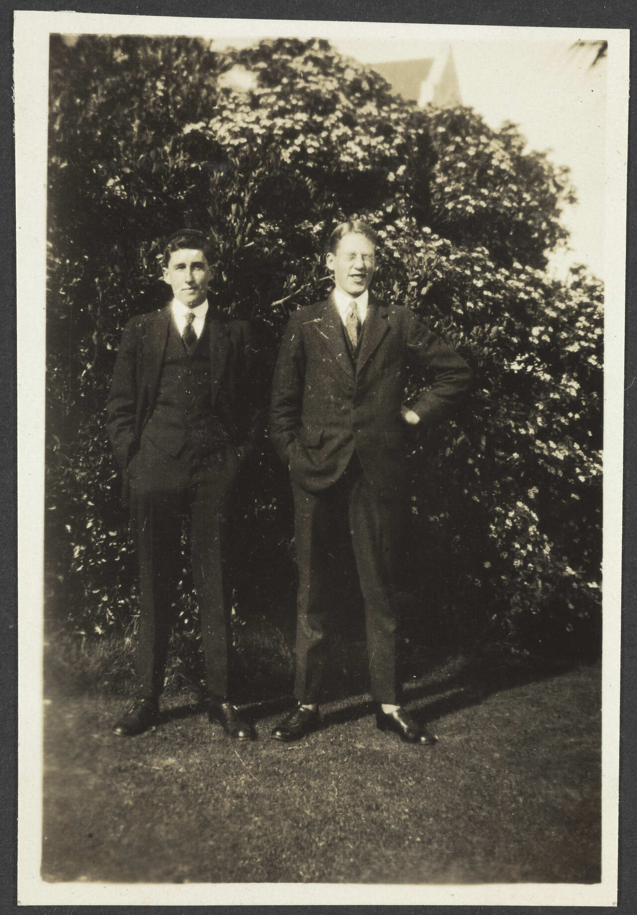 Two unidentified young men in suits
