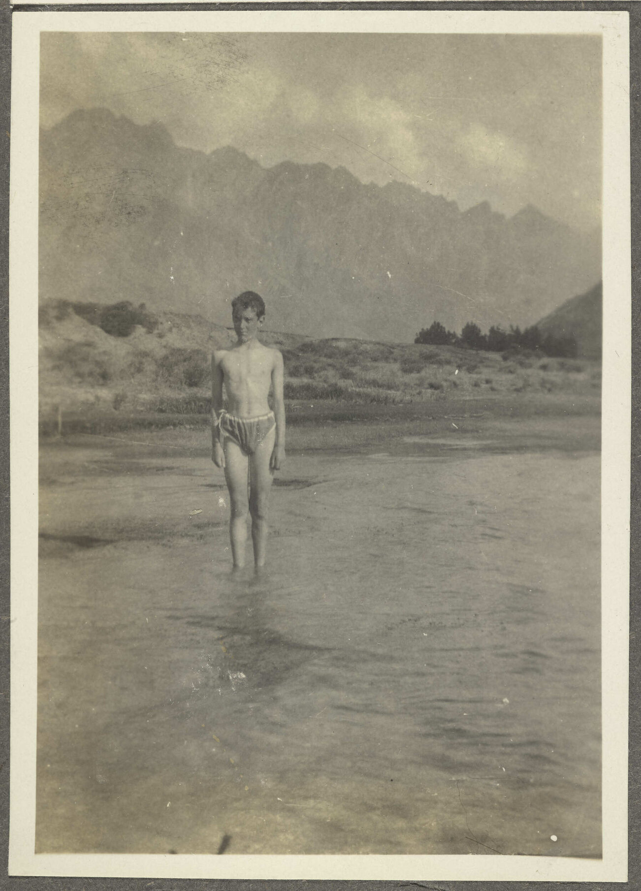 [Charles Brasch] standing in [Lake Wakatipu]