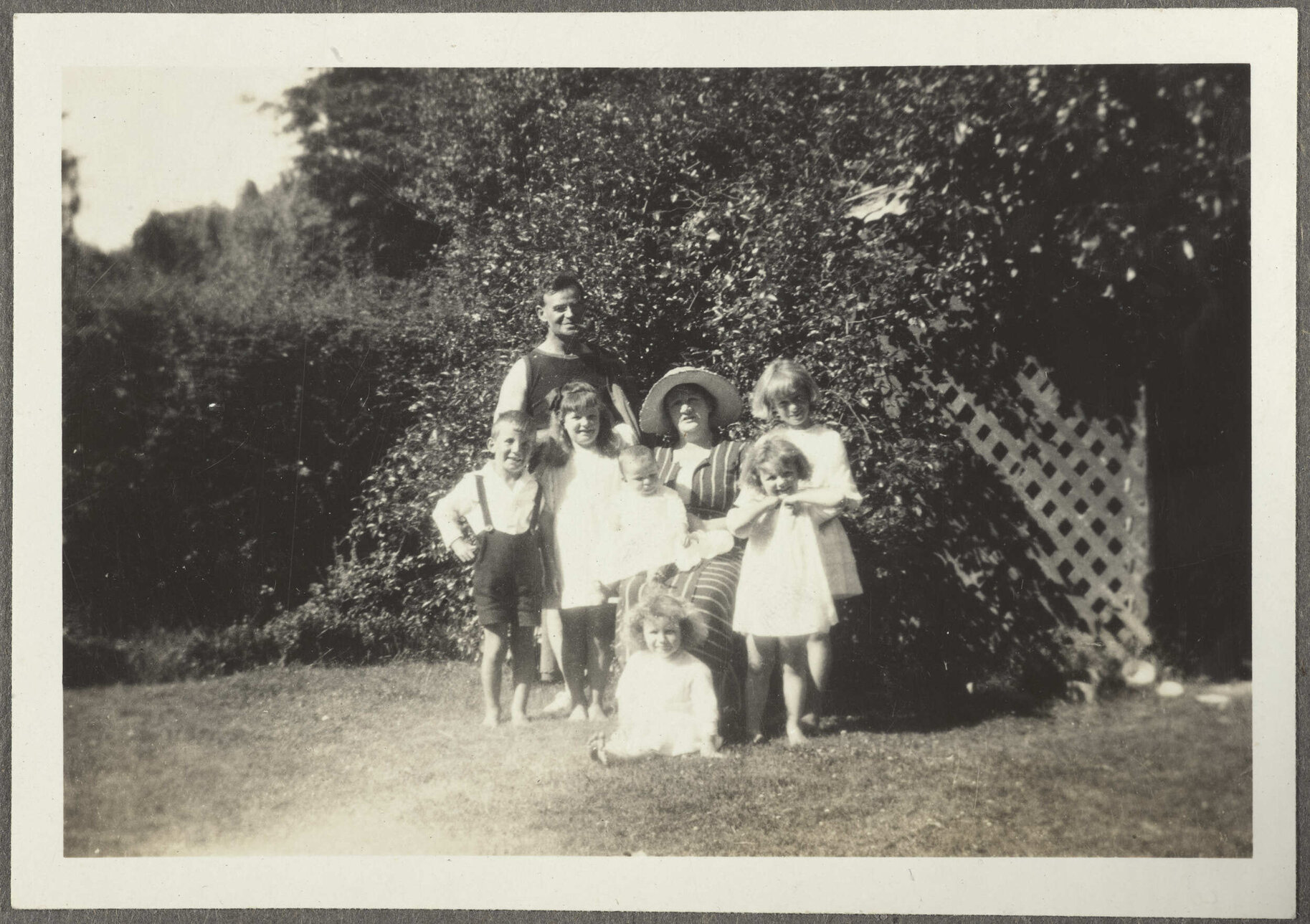 Unidentified woman, man and six children