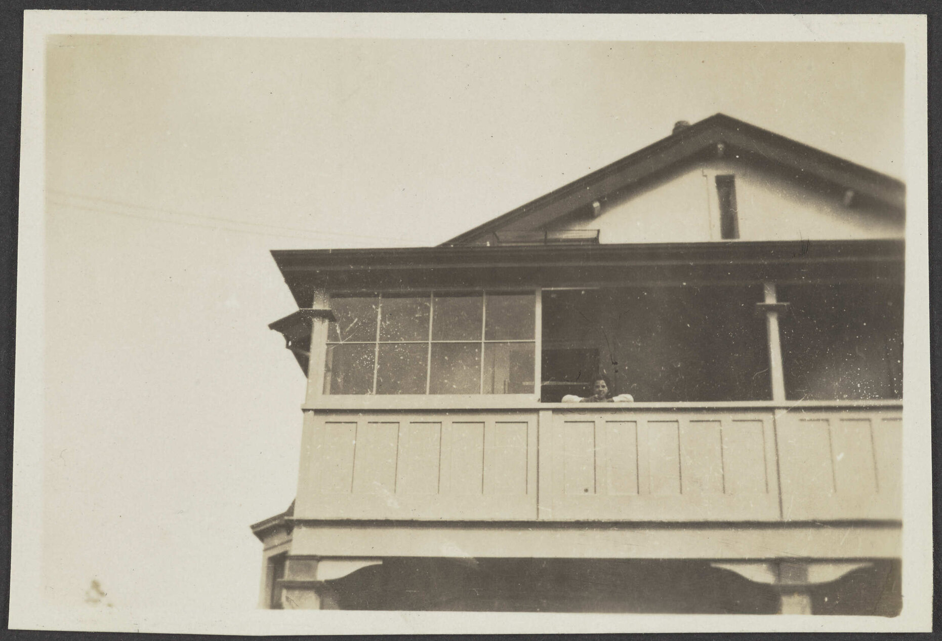 Looking up at verandah of wooden house