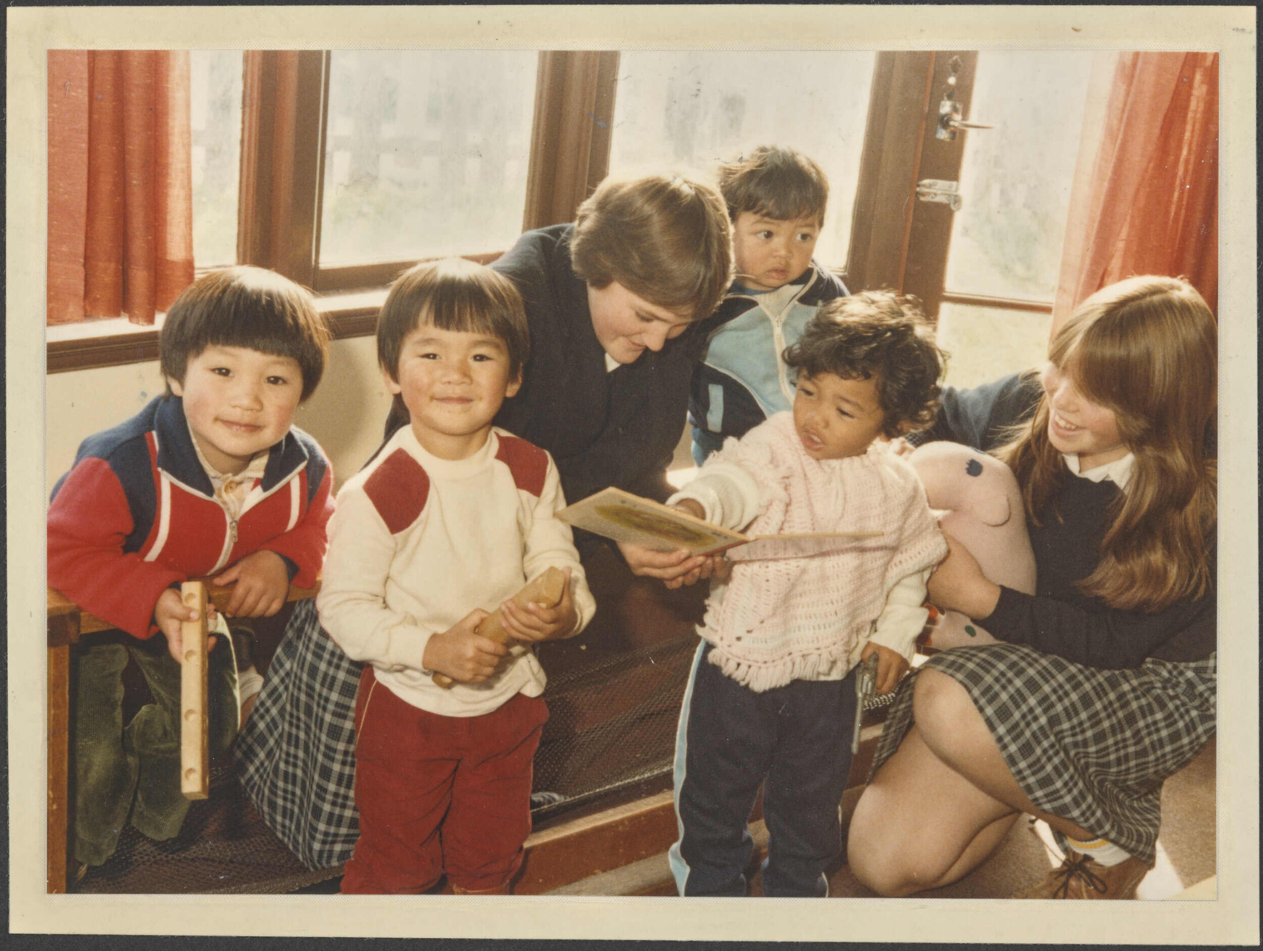 Otago Girls' High School pupils with children at the Childcare Centre, Cargill Street